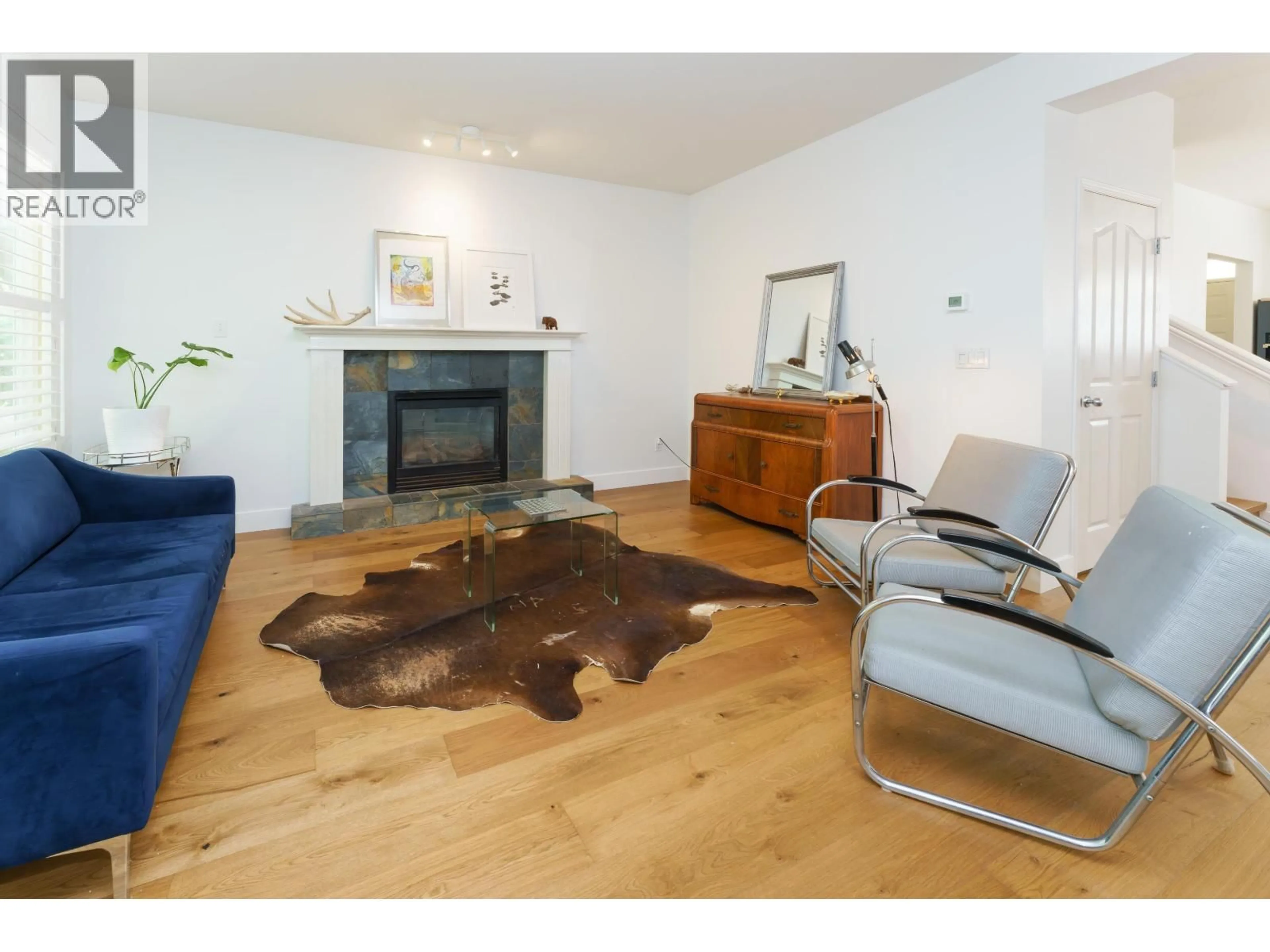 Living room with furniture, wood/laminate floor for 24254 103 AVENUE, Maple Ridge British Columbia V2W1Y1