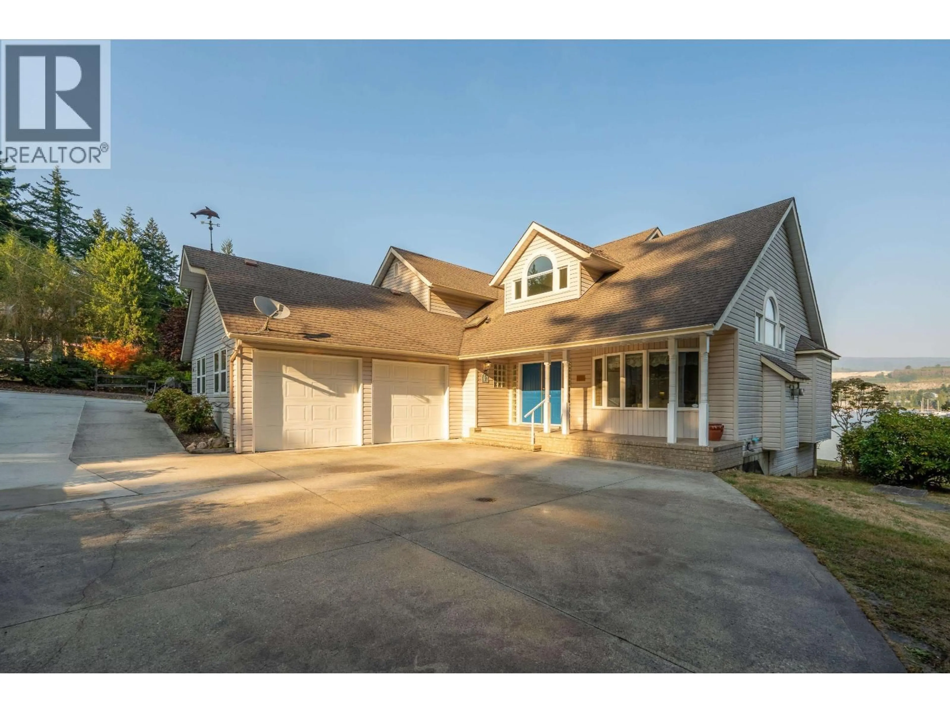 Home with vinyl exterior material, street for 5883 SPRAY STREET, Sechelt British Columbia V7Z0L7