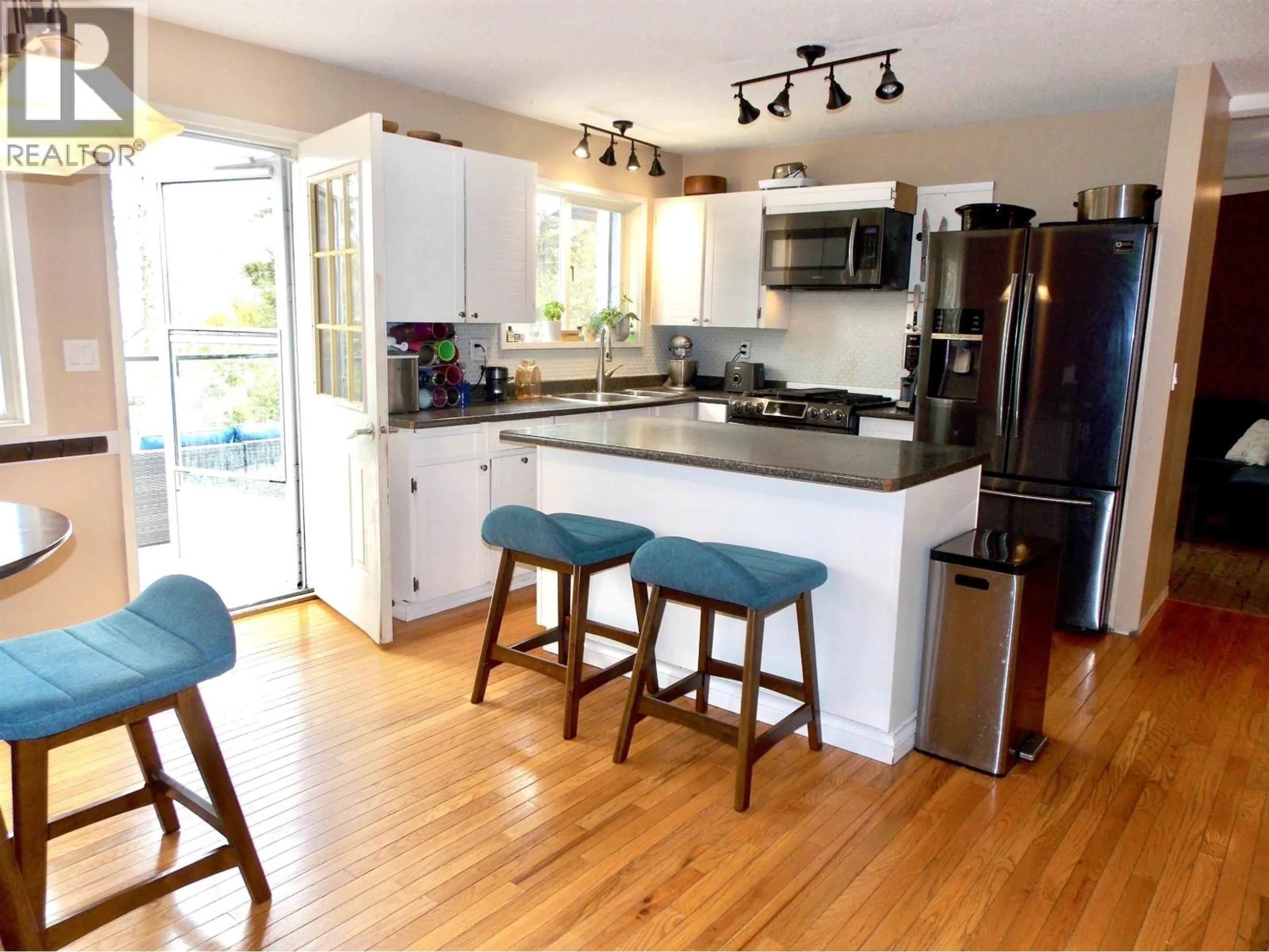 Open concept kitchen, wood/laminate floor for 2116 KINGLET ROAD, Williams Lake British Columbia V2G5G3