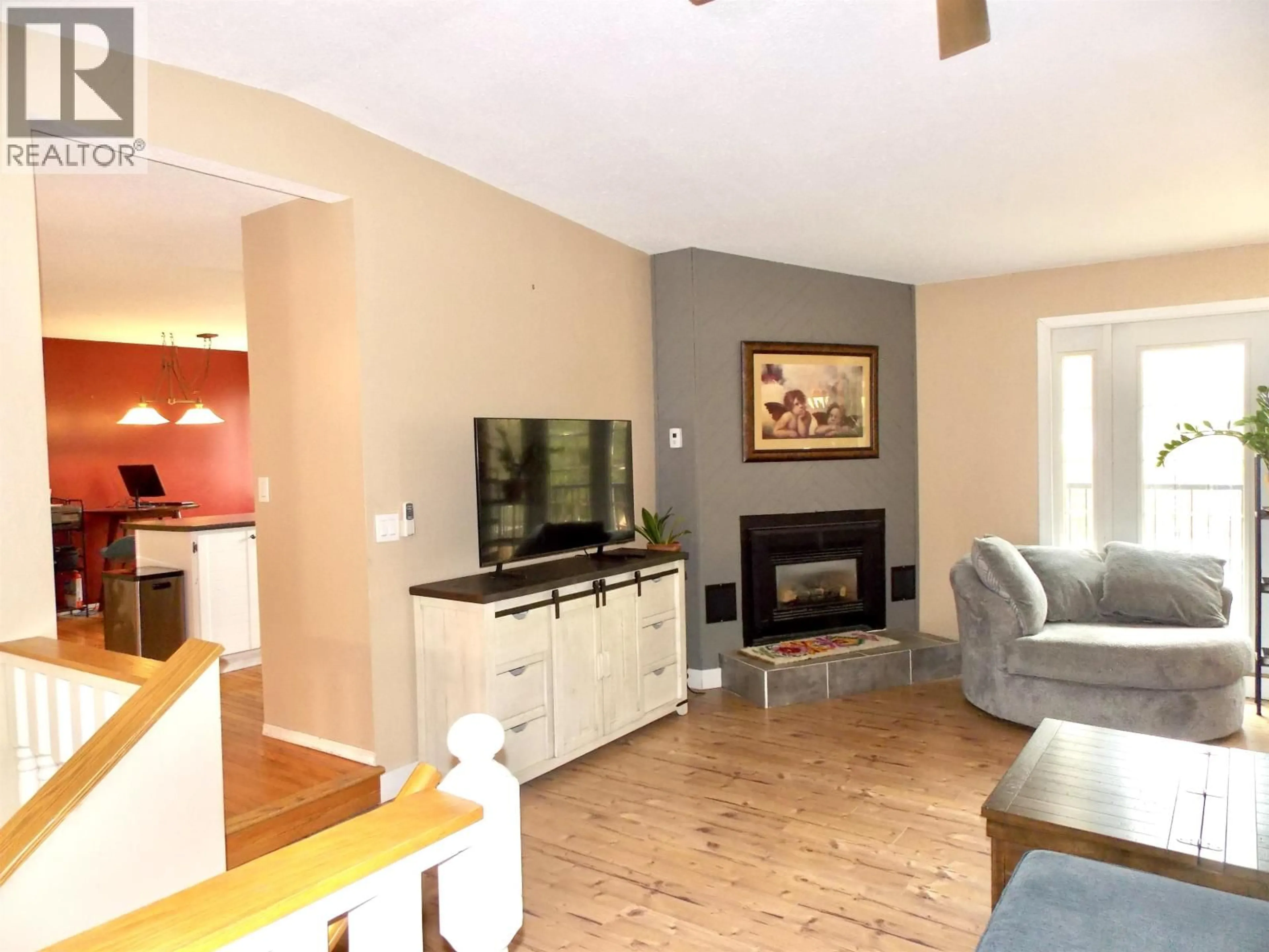 Living room with furniture, wood/laminate floor for 2116 KINGLET ROAD, Williams Lake British Columbia V2G5G3