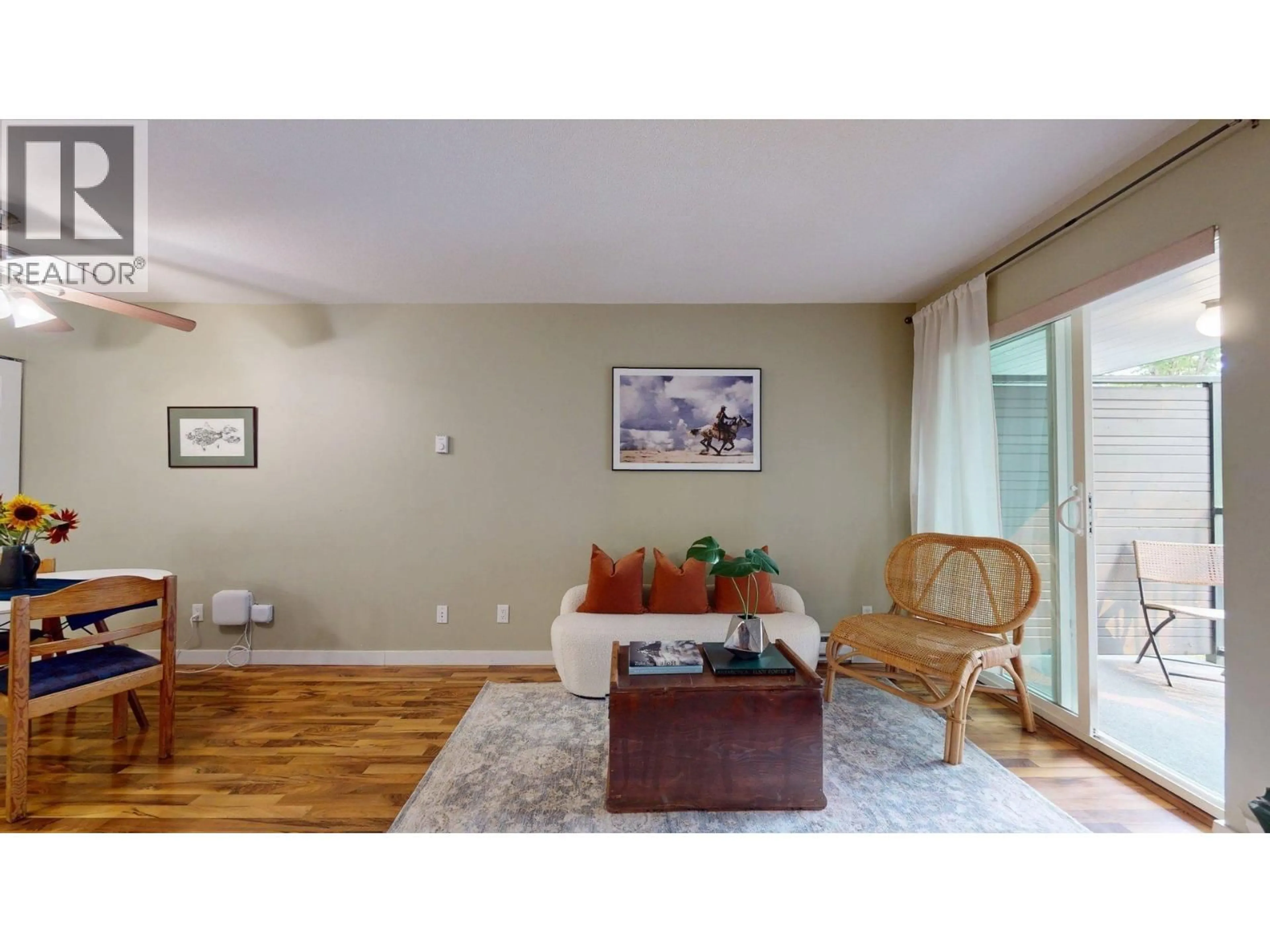 Living room with furniture, wood/laminate floor for C210 - 40140 WILLOW CRESCENT, Squamish British Columbia V8B0M1