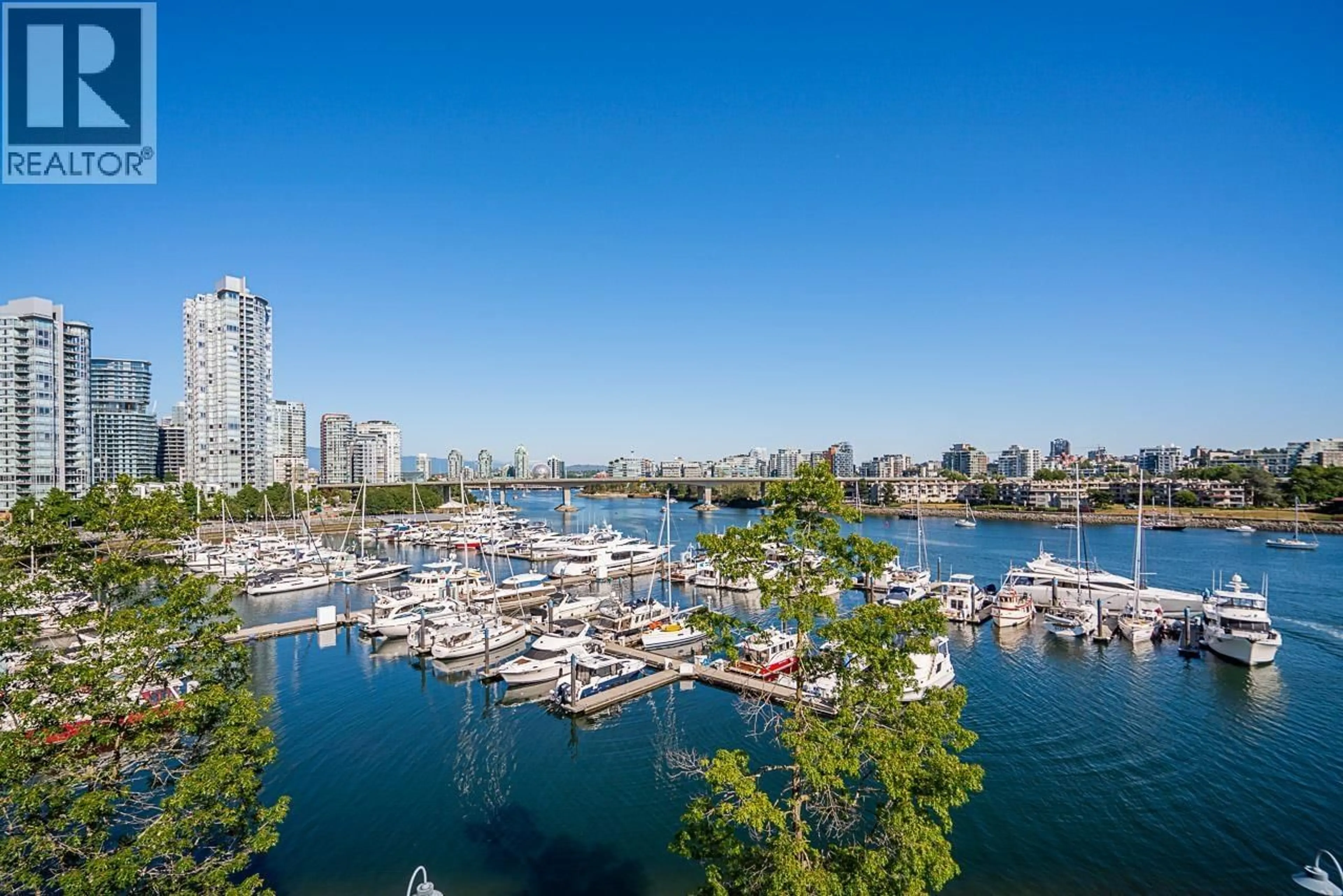 A pic from outside/outdoor area/front of a property/back of a property/a pic from drone, water/lake/river/ocean view for 319 - 1228 MARINASIDE CRESCENT, Vancouver British Columbia V6Z2W4
