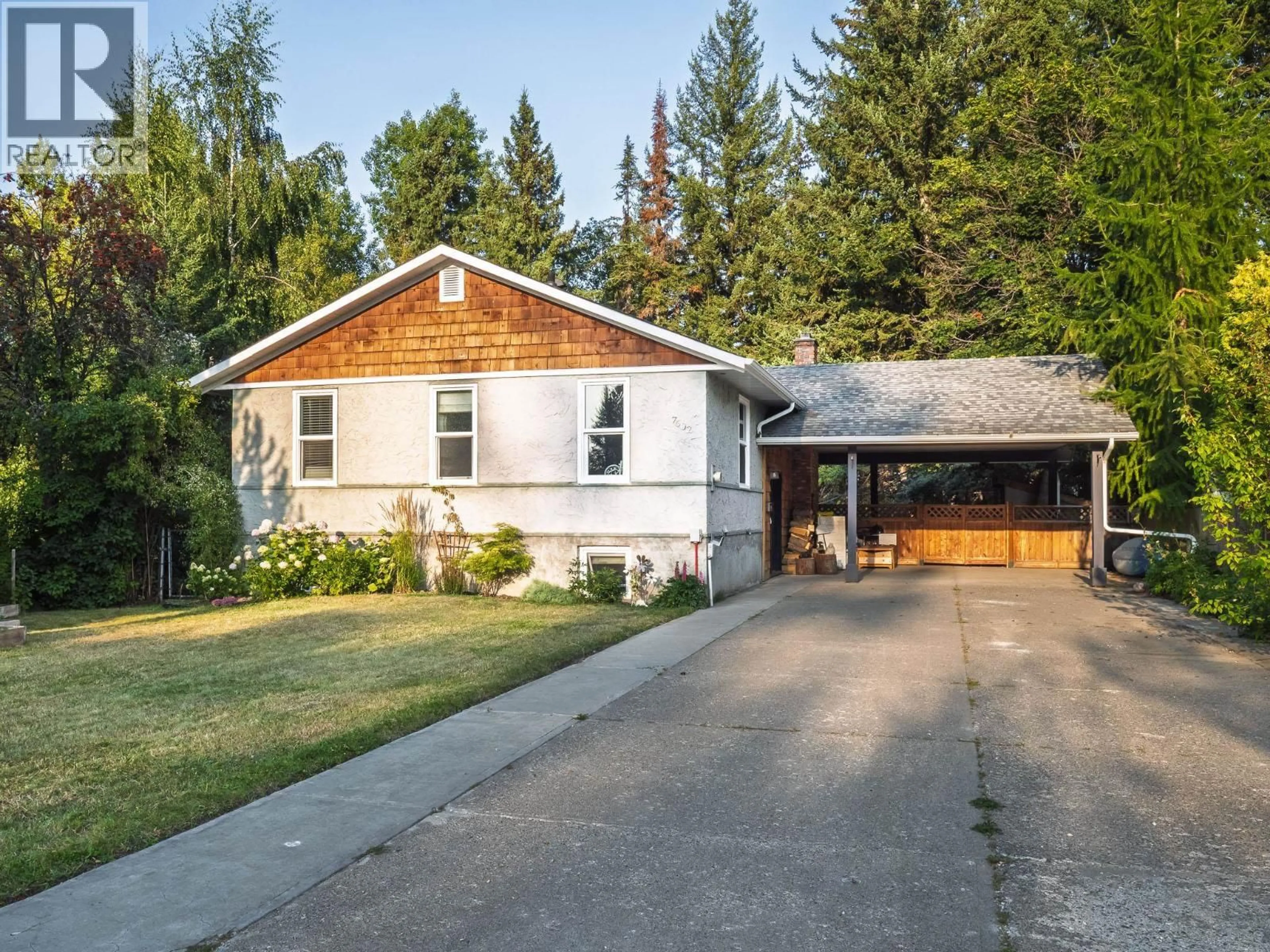 Home with vinyl exterior material, street for 7602 JEAN DE BREBEUF CRESCENT, Prince George British Columbia V2N3P2