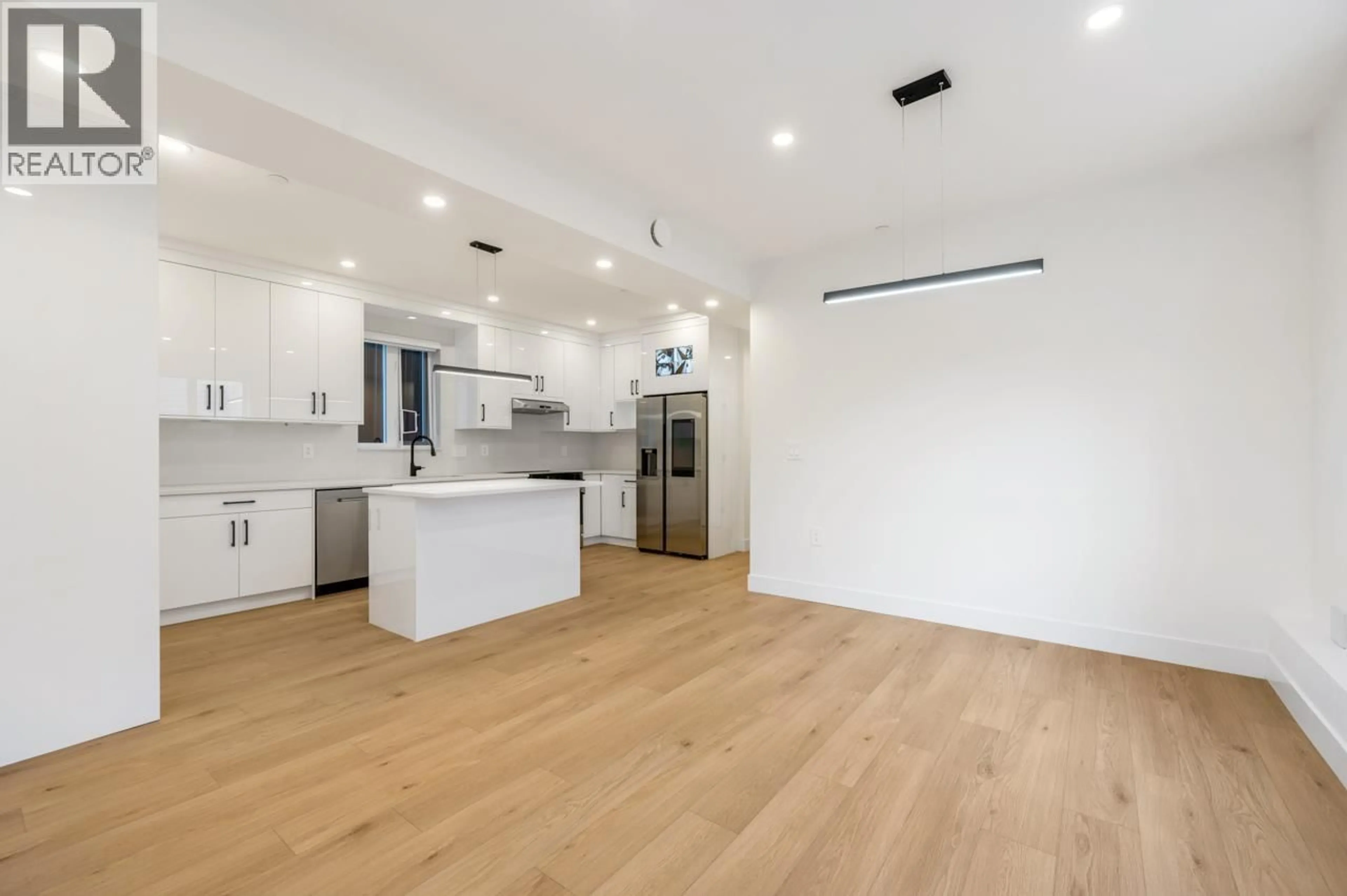 Open concept kitchen, wood/laminate floor for 2 - 3096 VANNESS AVENUE, Vancouver British Columbia V5R5A1