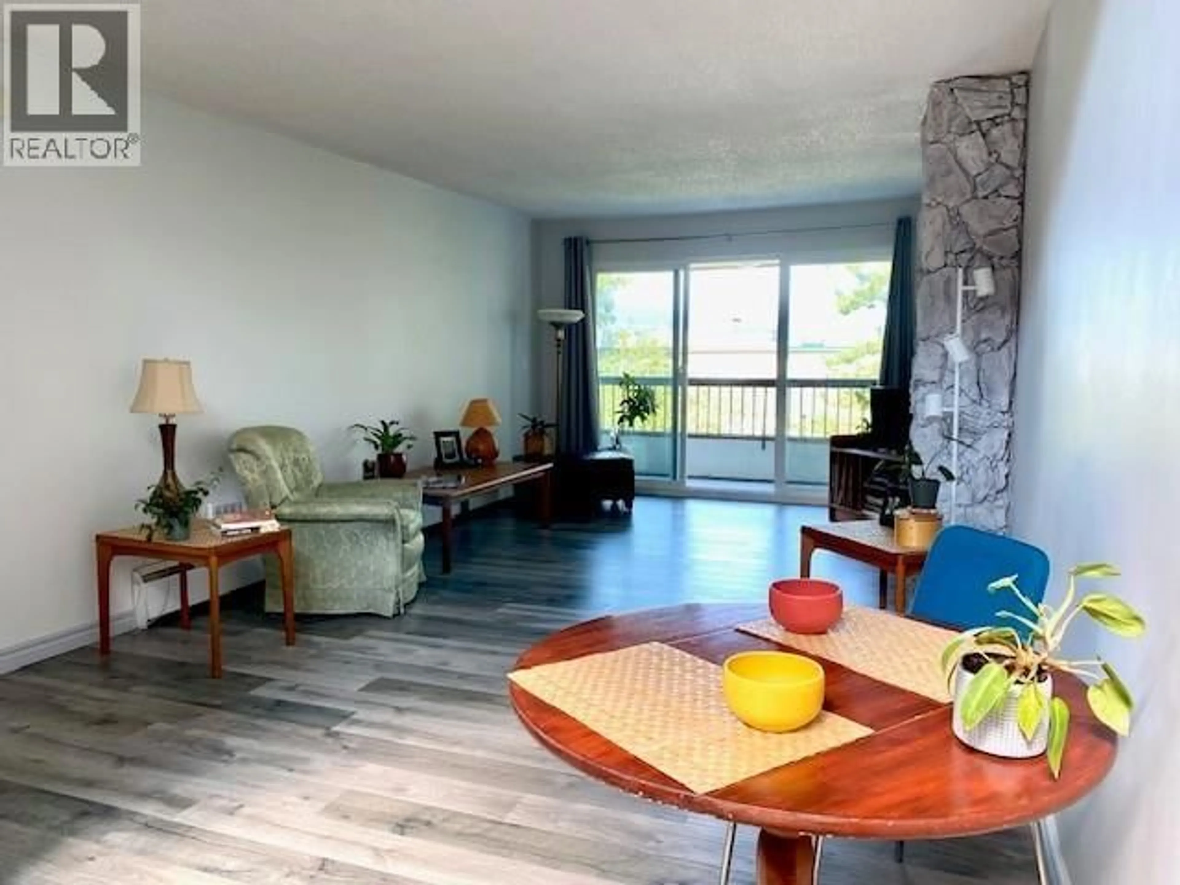 Living room with furniture, wood/laminate floor for 309 - 550 6TH AVENUE, Vancouver British Columbia V5T4H2