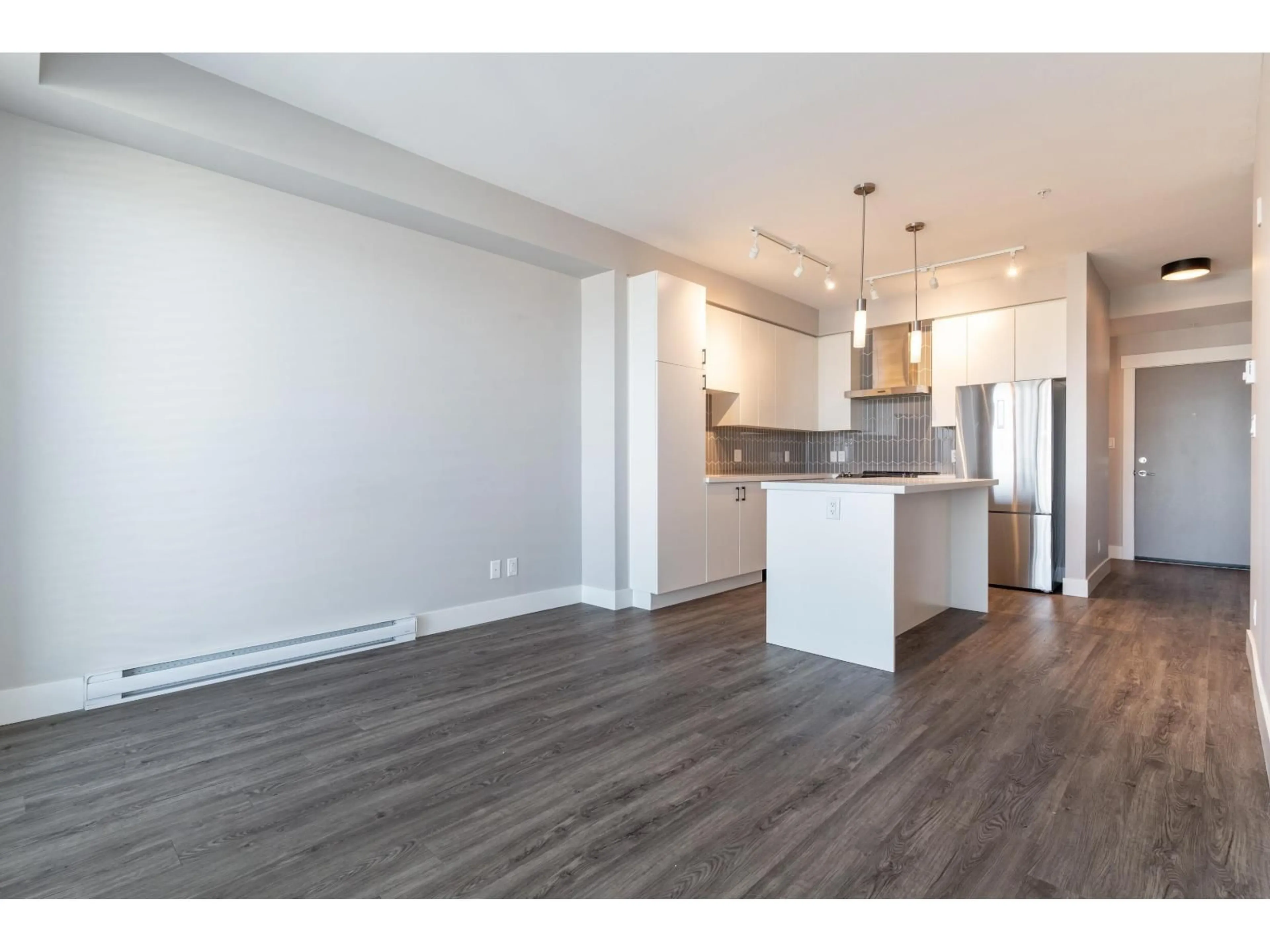Open concept kitchen, wood/laminate floor for B302 - 20838 78B, Langley British Columbia V2Y3M2