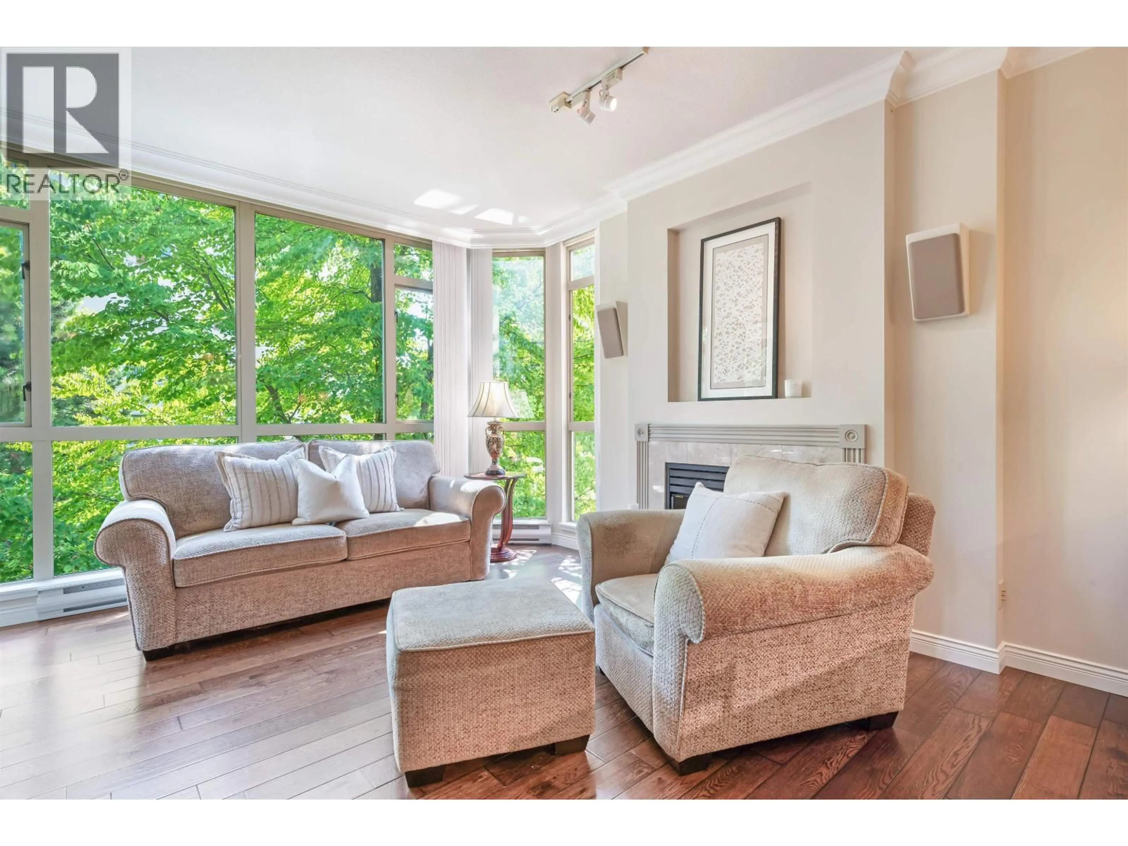Living room with furniture, wood/laminate floor for 302 - 160 KEITH ROAD, North Vancouver British Columbia V7M3M2