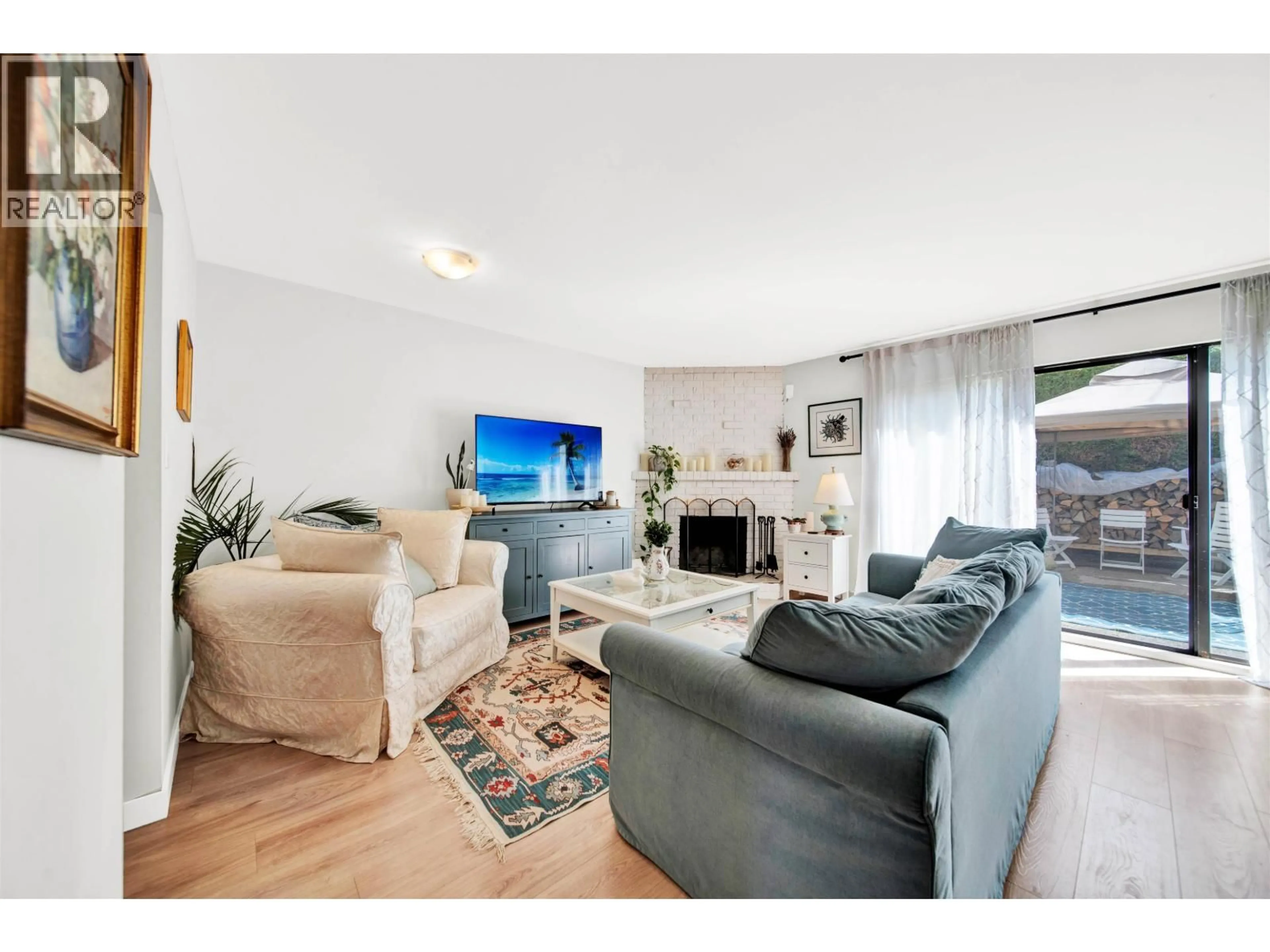Living room with furniture, wood/laminate floor for 21 - 10680 SPRINGMONT DRIVE, Richmond British Columbia V7E1W1