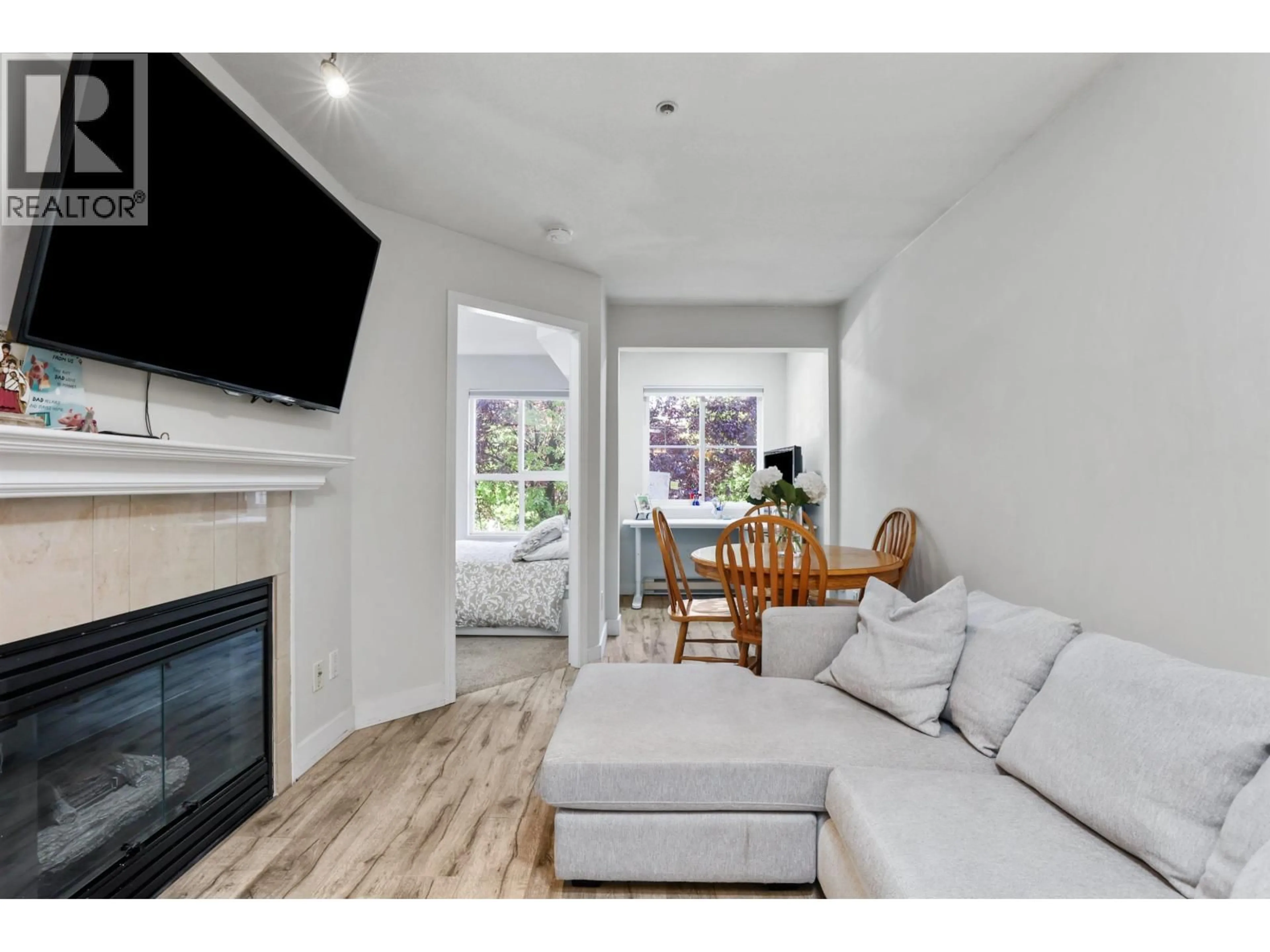 Living room with furniture, wood/laminate floor for 203 - 3278 HEATHER STREET, Vancouver British Columbia V5Z4R9