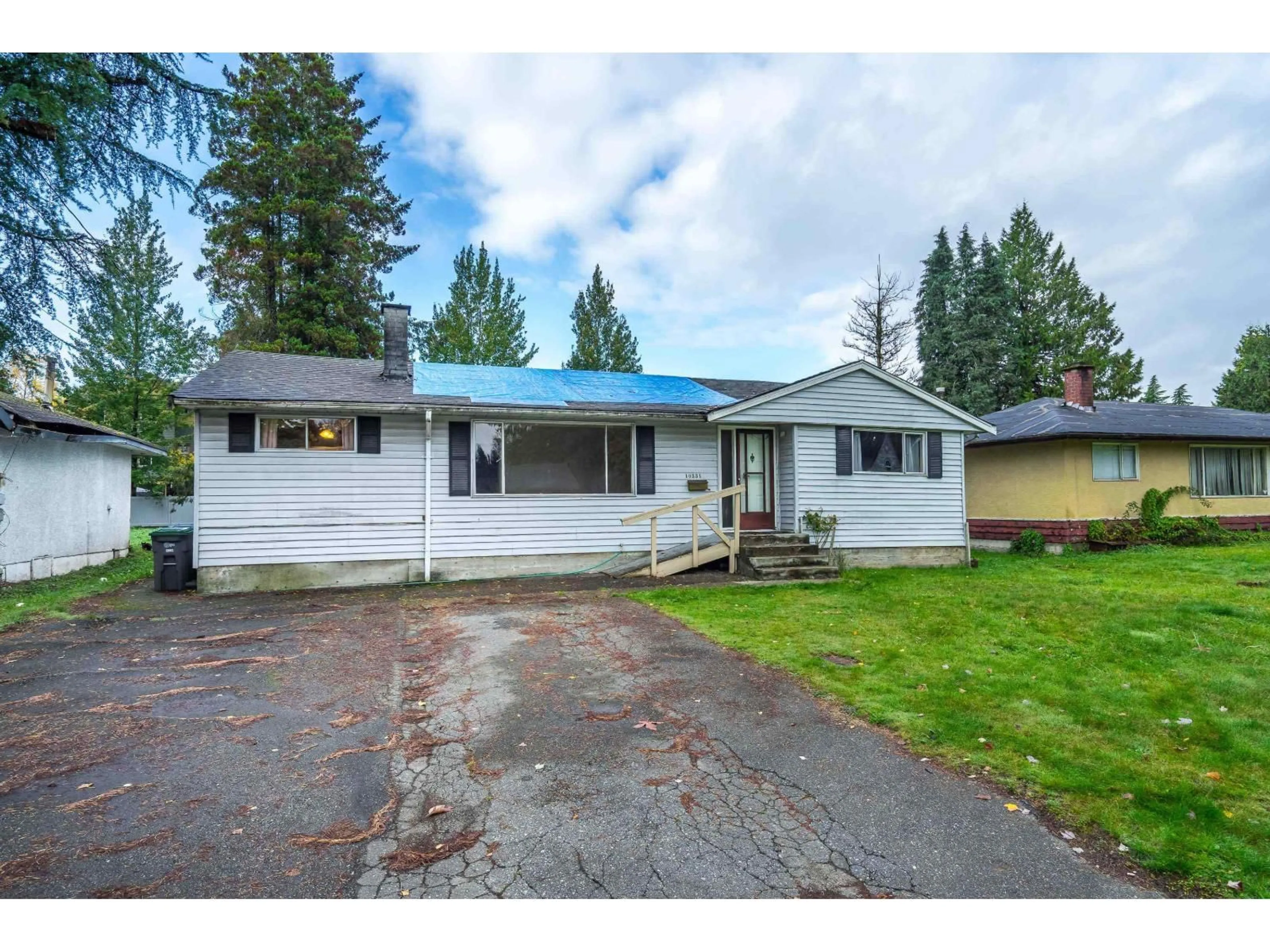 Home with vinyl exterior material, street for 10331 155A, Surrey British Columbia V3R4K4