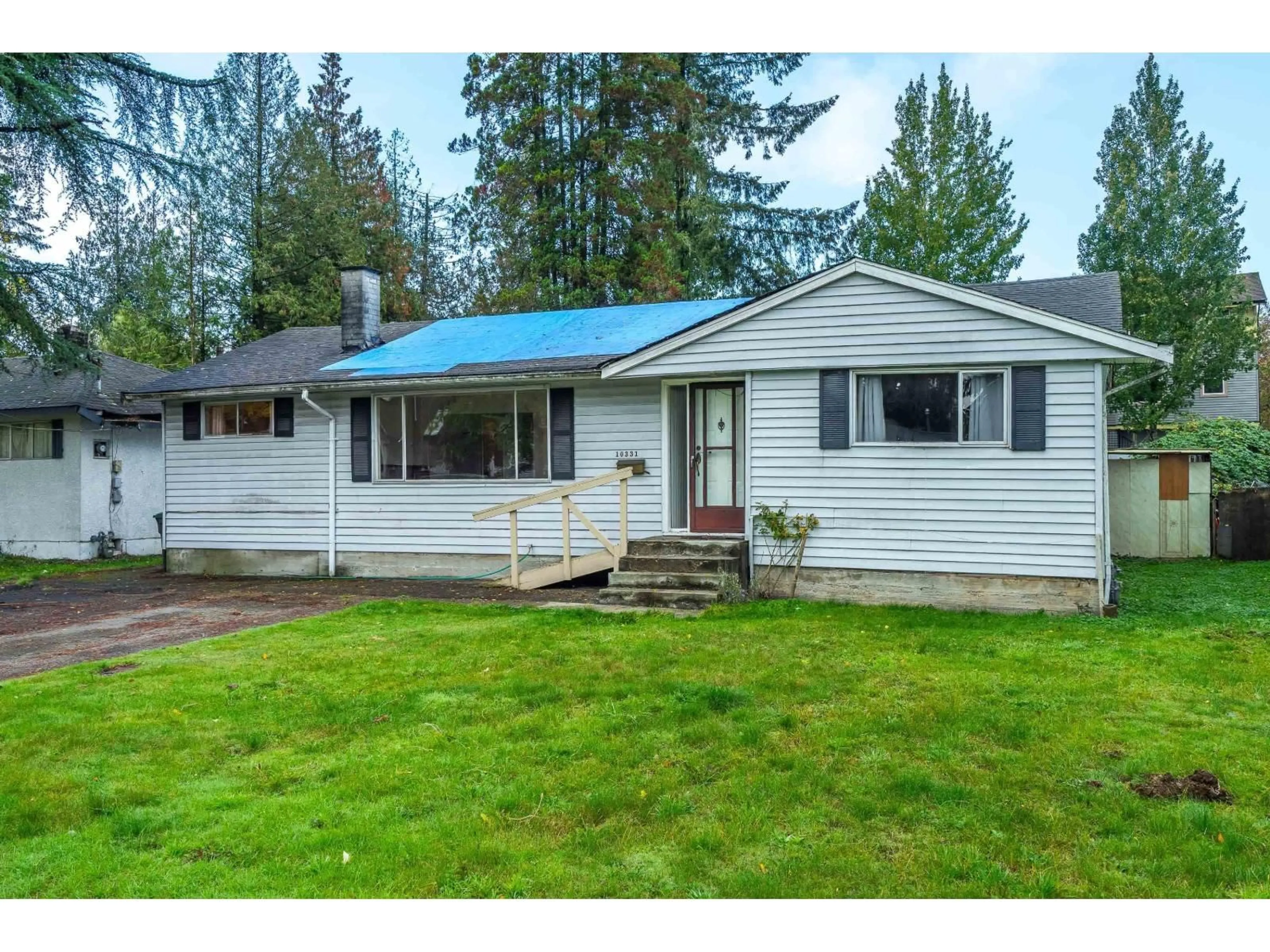 Home with vinyl exterior material, street for 10331 155A, Surrey British Columbia V3R4K4
