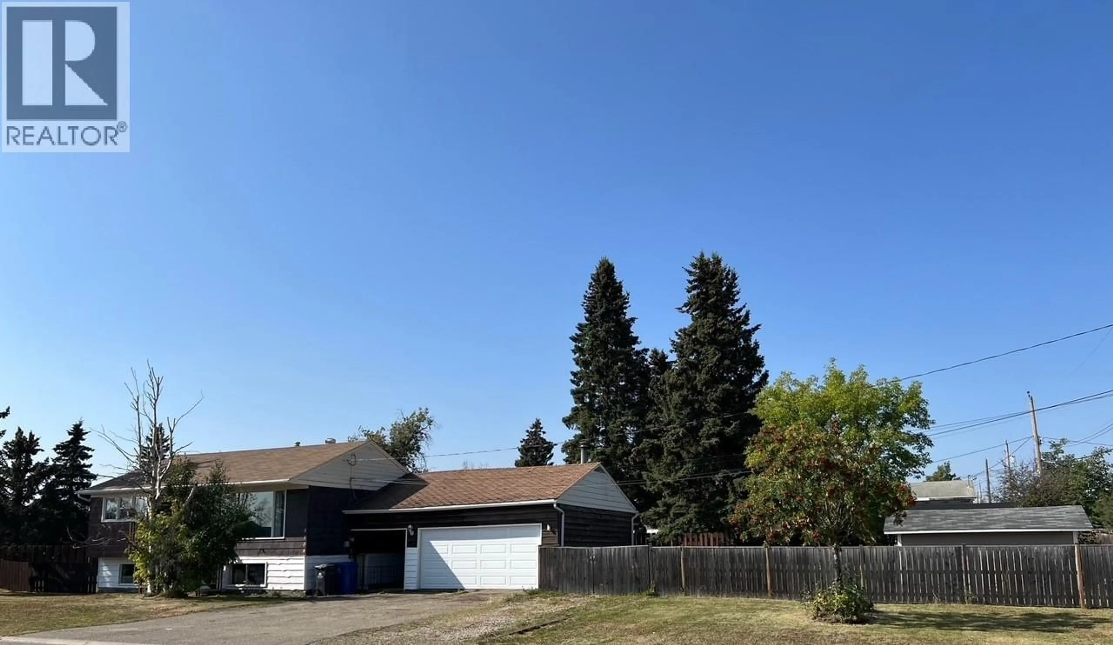 A pic from outside/outdoor area/front of a property/back of a property/a pic from drone, street for 9704 81 STREET, Fort St. John British Columbia V1J3C3