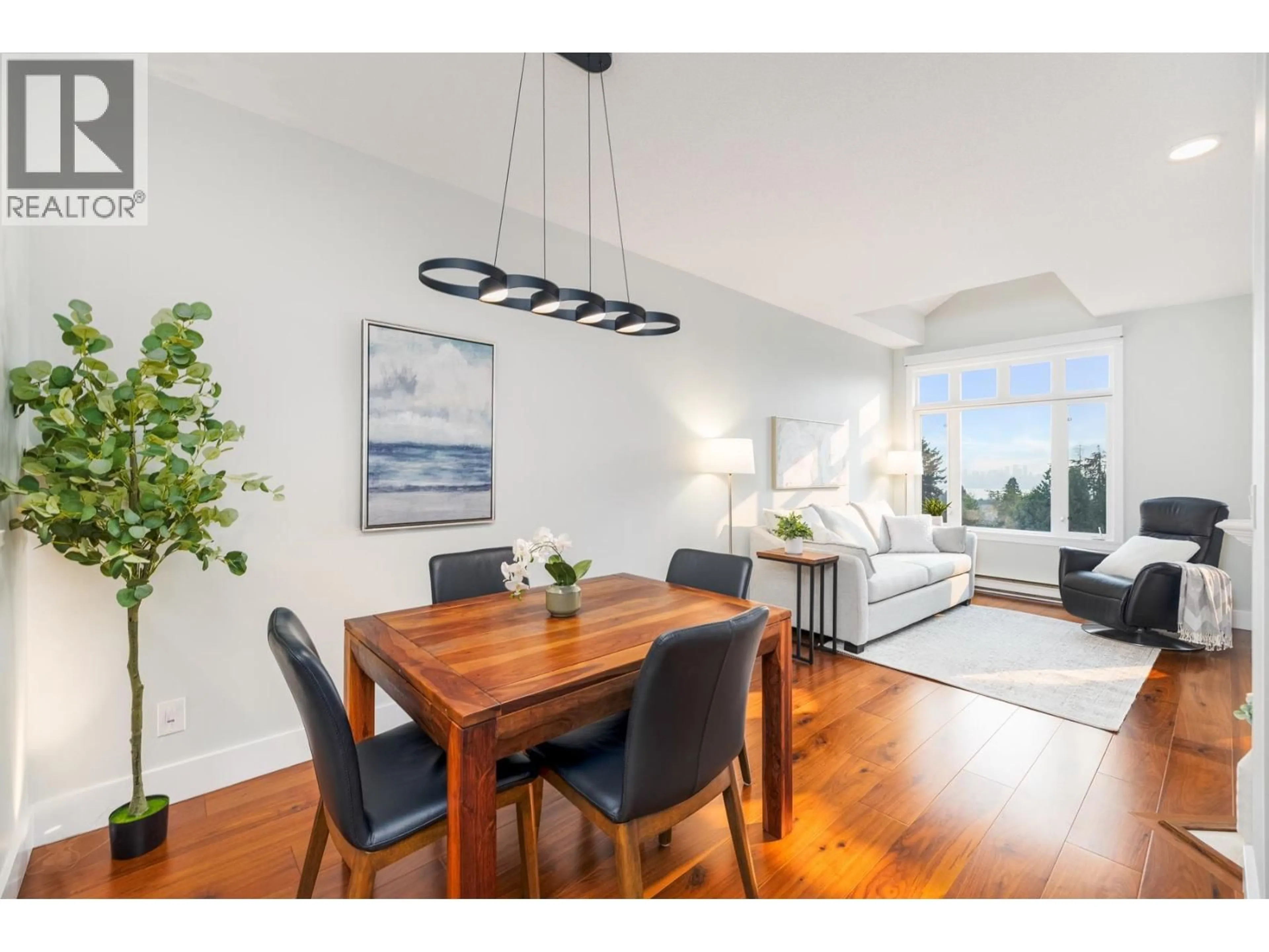 Dining room, wood/laminate floor for 404 - 121 29TH STREET, North Vancouver British Columbia V7N4L6
