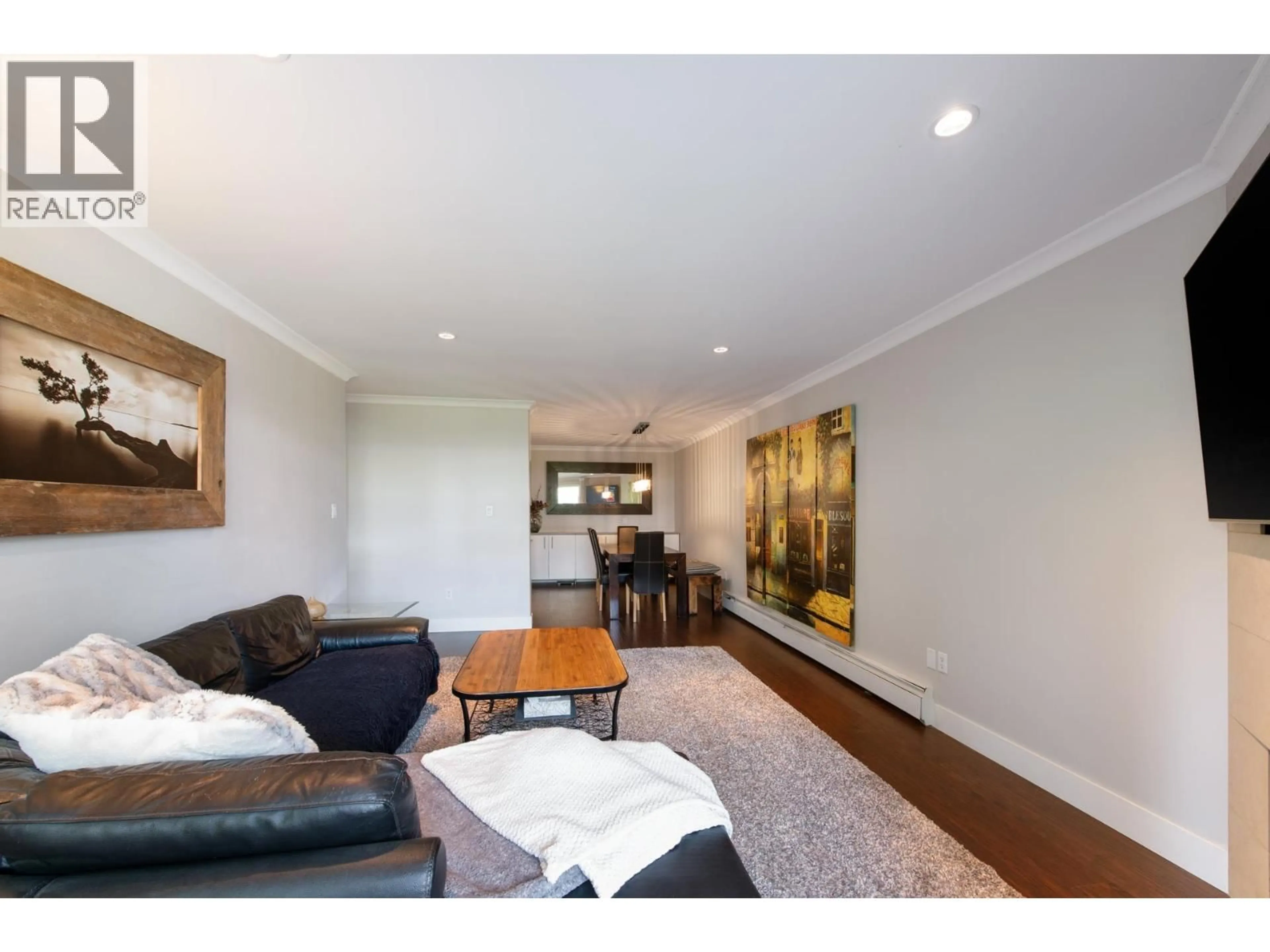Living room with furniture, wood/laminate floor for 204 - 341 3RD STREET, North Vancouver British Columbia V7M1G3