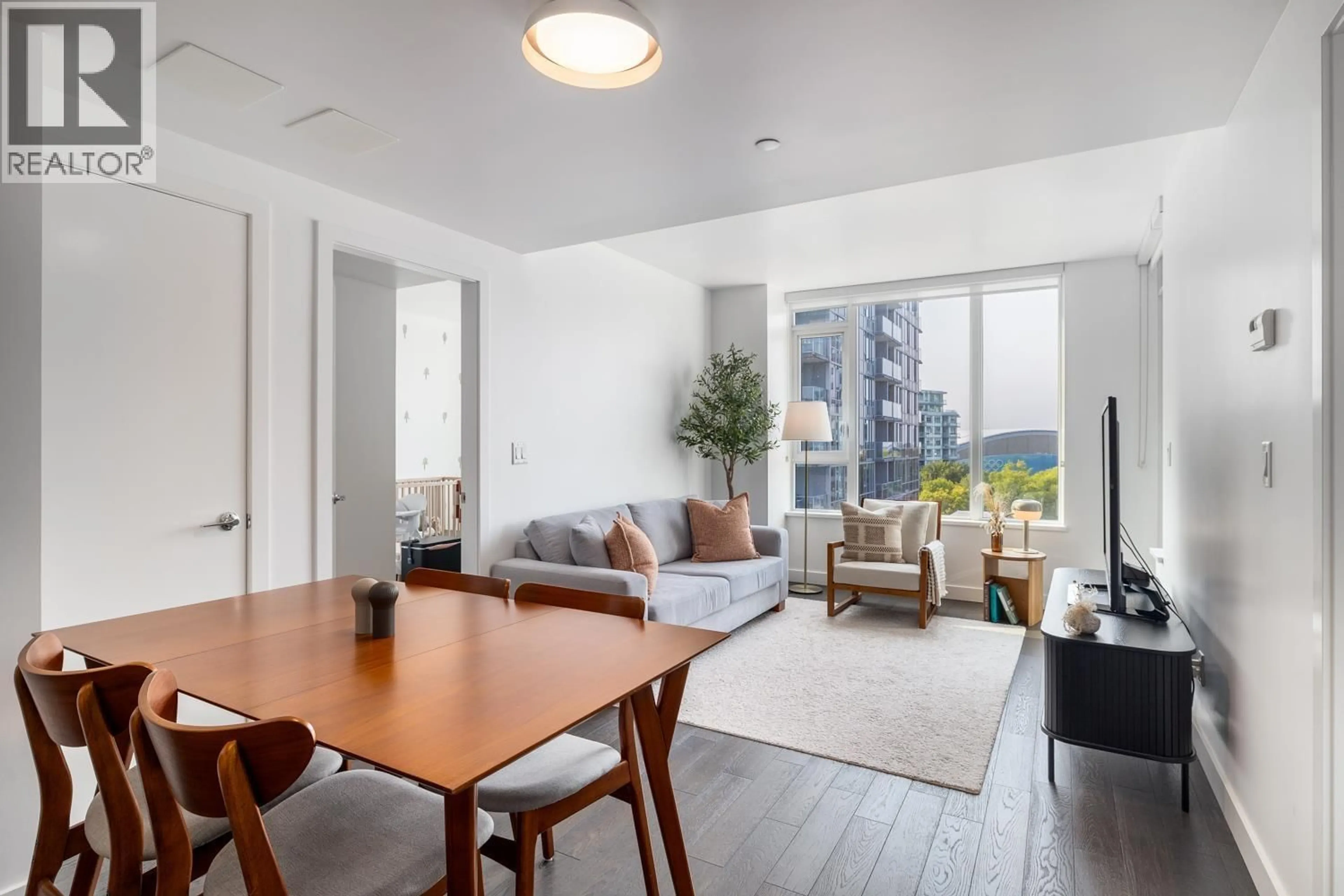 Living room with furniture, wood/laminate floor for 906 - 7488 LANSDOWNE ROAD, Richmond British Columbia V7C0B9
