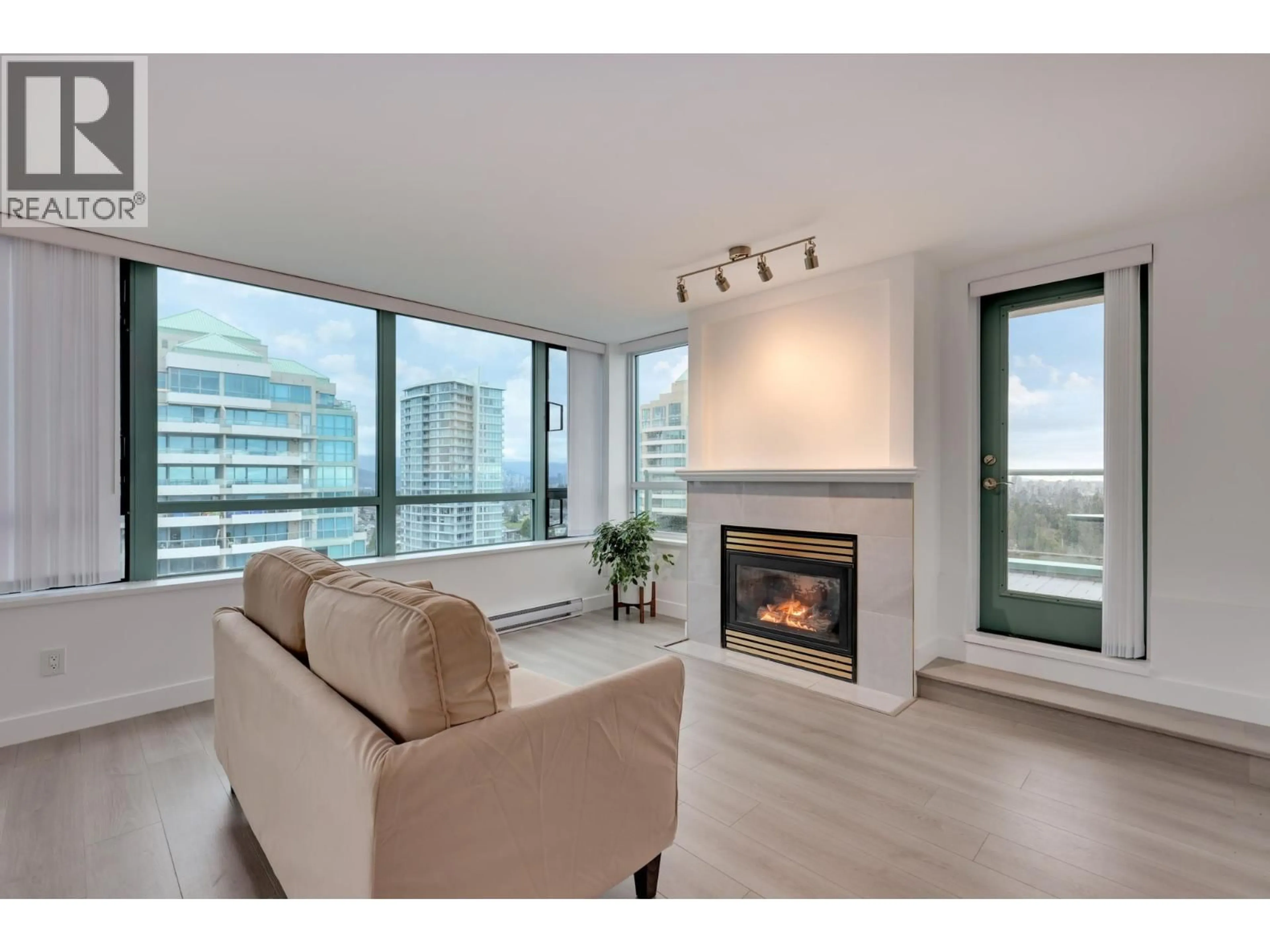 Living room with furniture, wood/laminate floor for 1803 - 6622 SOUTHOAKS CRESCENT, Burnaby British Columbia V5E4K2