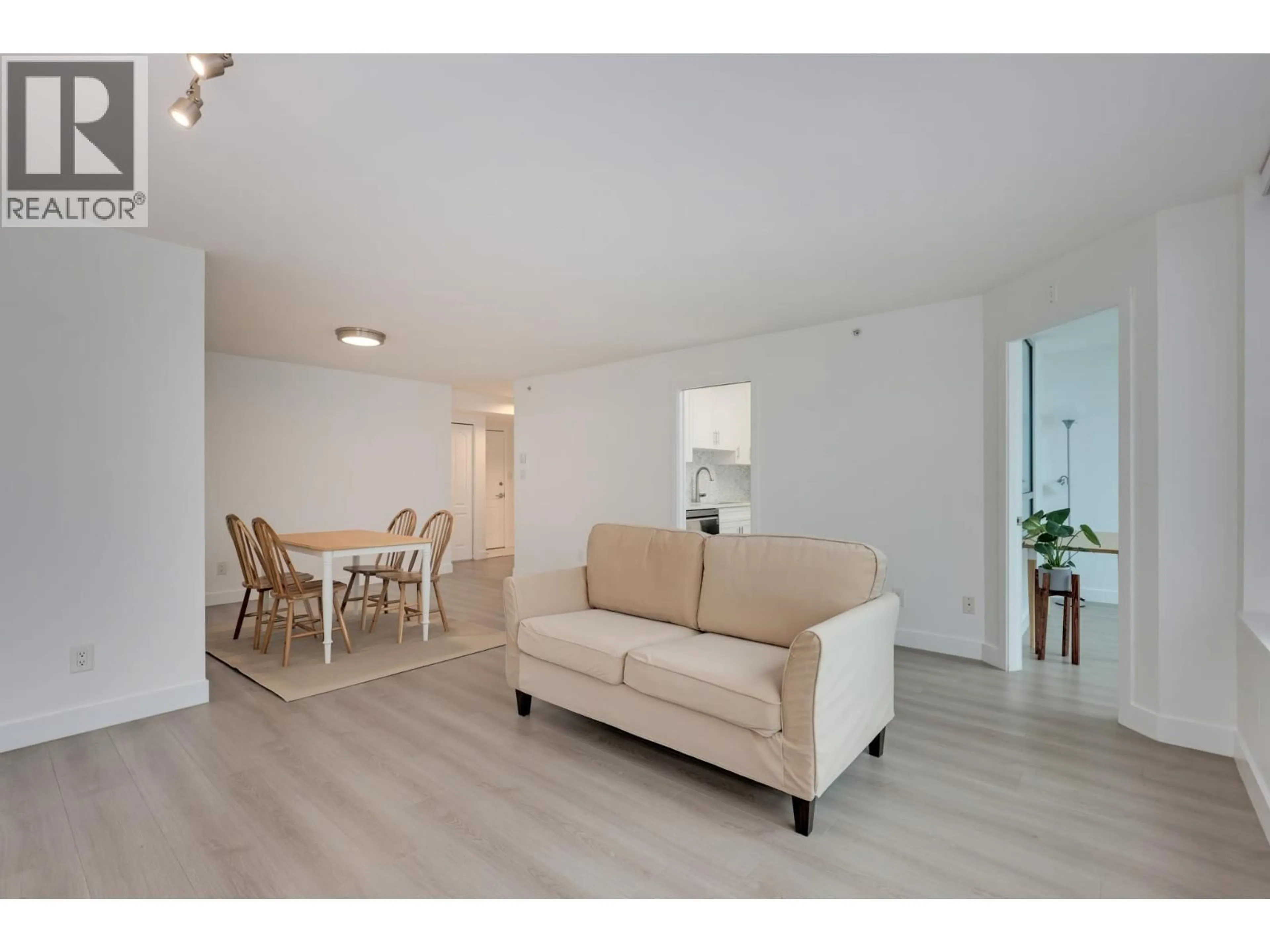 Living room with furniture, wood/laminate floor for 1803 - 6622 SOUTHOAKS CRESCENT, Burnaby British Columbia V5E4K2
