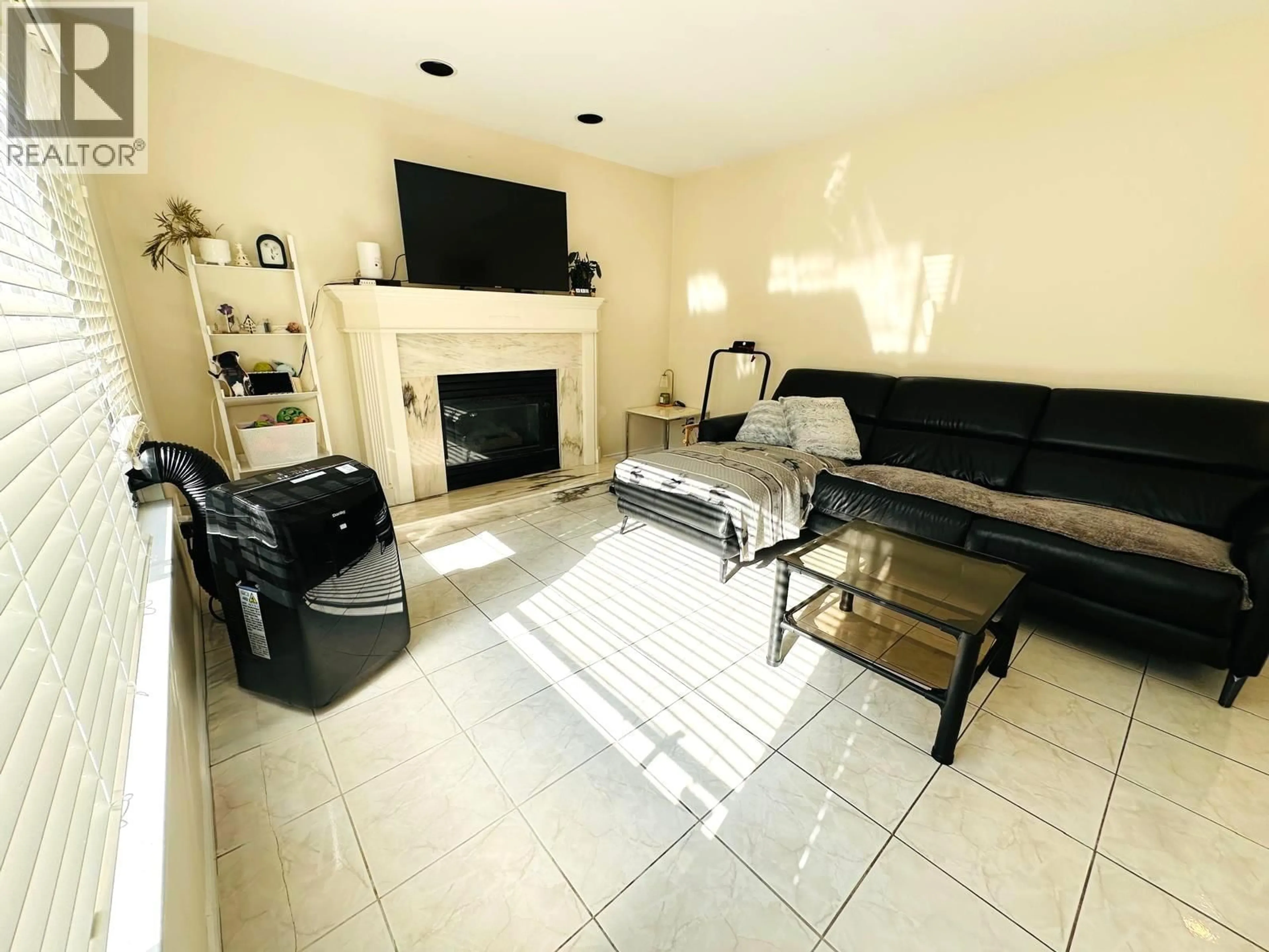 Living room with furniture, ceramic/tile floor for 4191 FISHER DRIVE, Richmond British Columbia V6X3S4