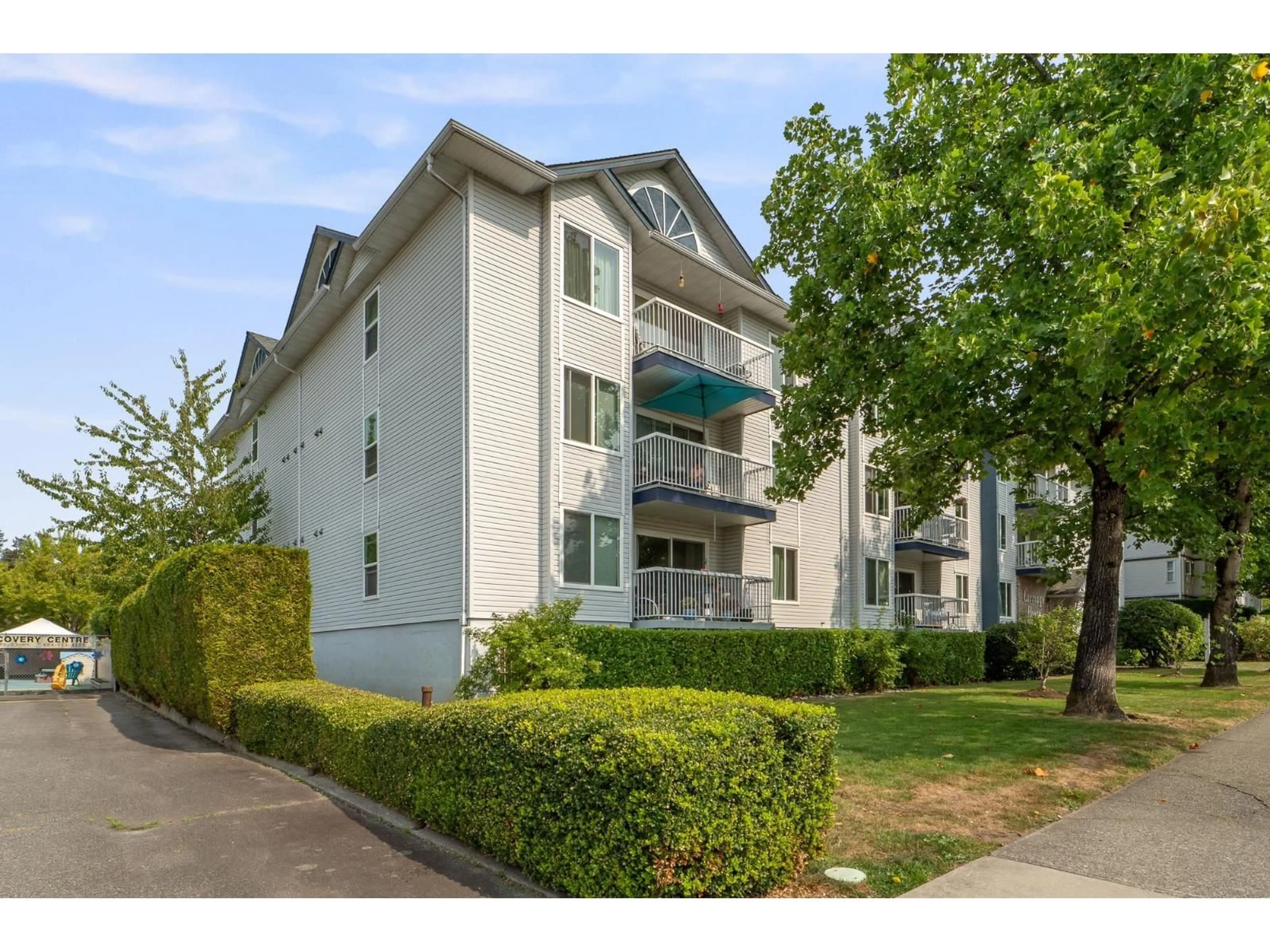 A pic from outside/outdoor area/front of a property/back of a property/a pic from drone, street for 309 - 17695 58, Surrey British Columbia V3S1L5