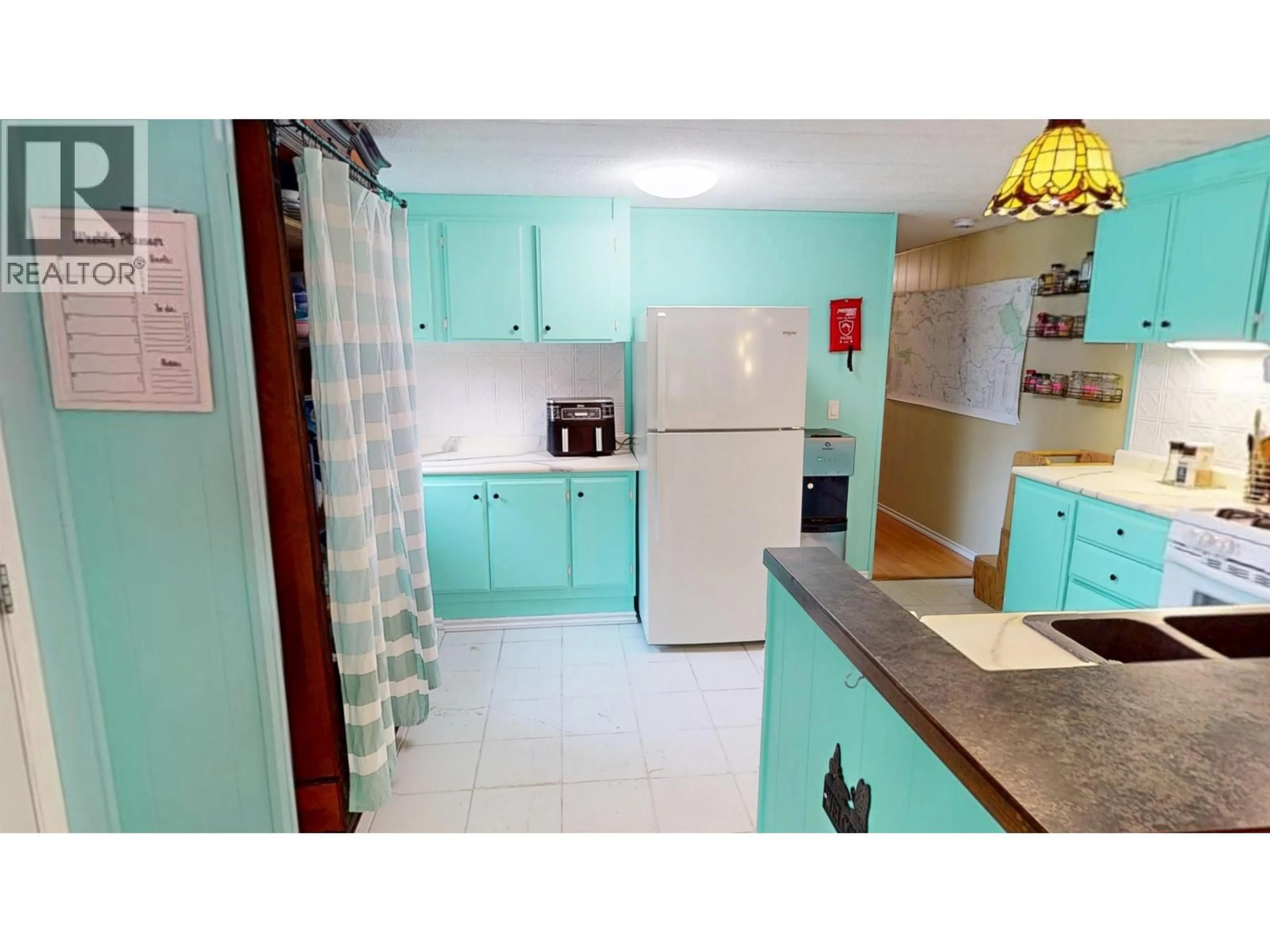 Standard kitchen, ceramic/tile floor for 713 TIBBLES ROAD, Quesnel British Columbia V2J3H9