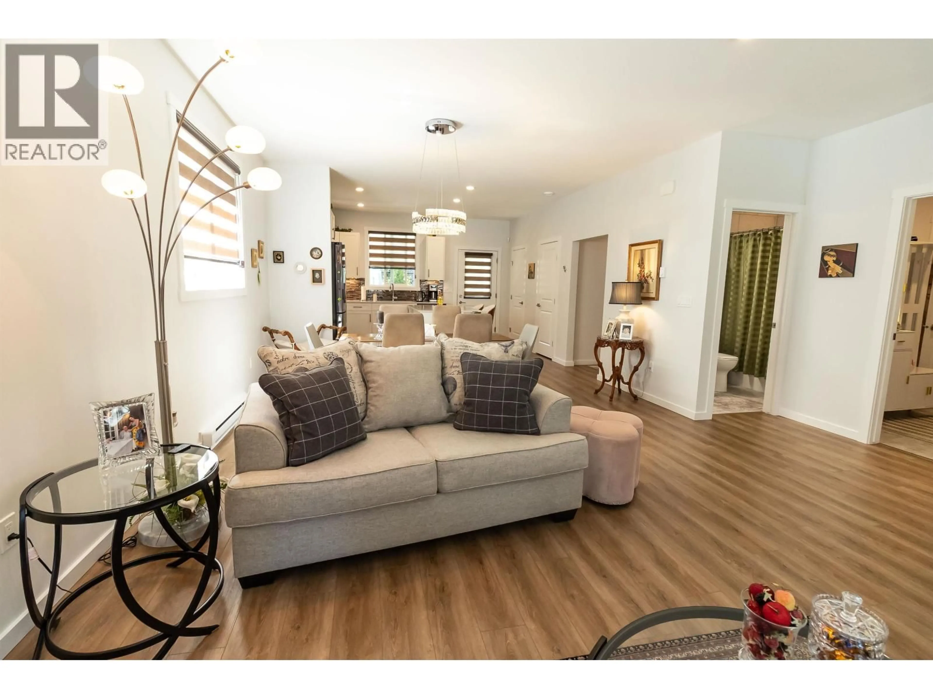 Living room with furniture, wood/laminate floor for 10 - 4921 HALLIWELL AVENUE, Terrace British Columbia V8G2J7