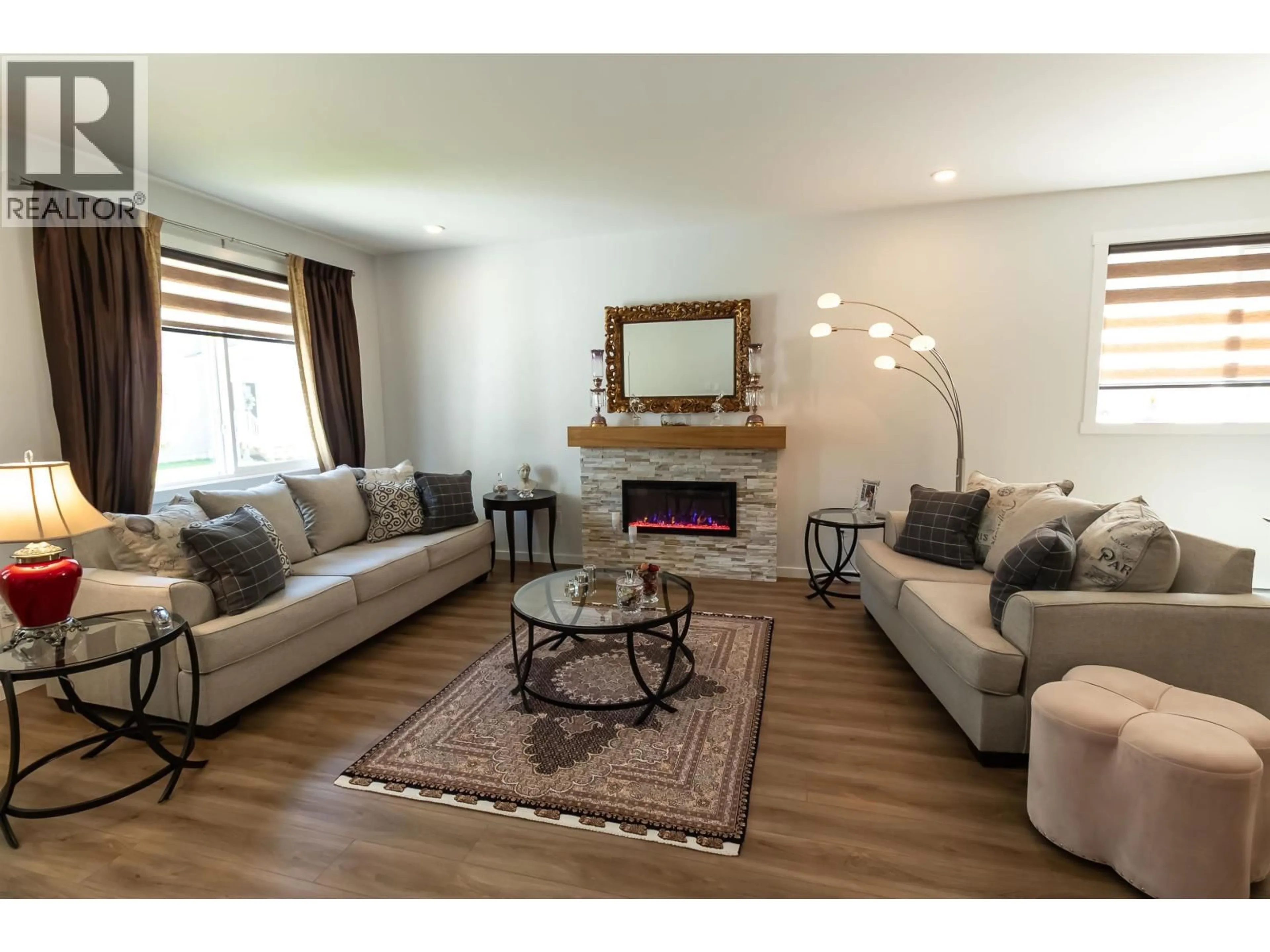 Living room with furniture, wood/laminate floor for 10 - 4921 HALLIWELL AVENUE, Terrace British Columbia V8G2J7