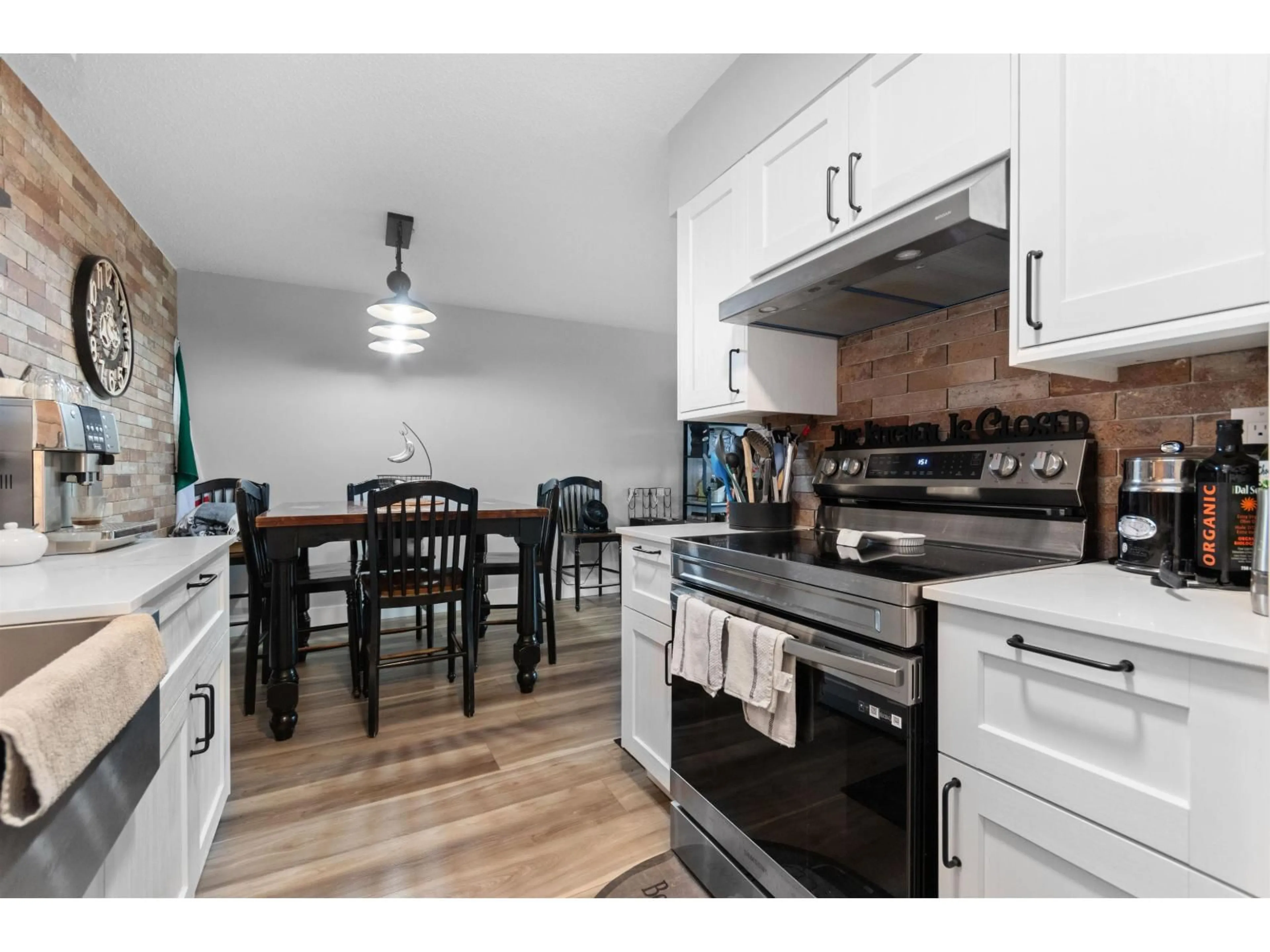 Open concept kitchen, wood/laminate floor for 223 - 45598 MCINTOSH DRIVE, Chilliwack British Columbia V2P7J3