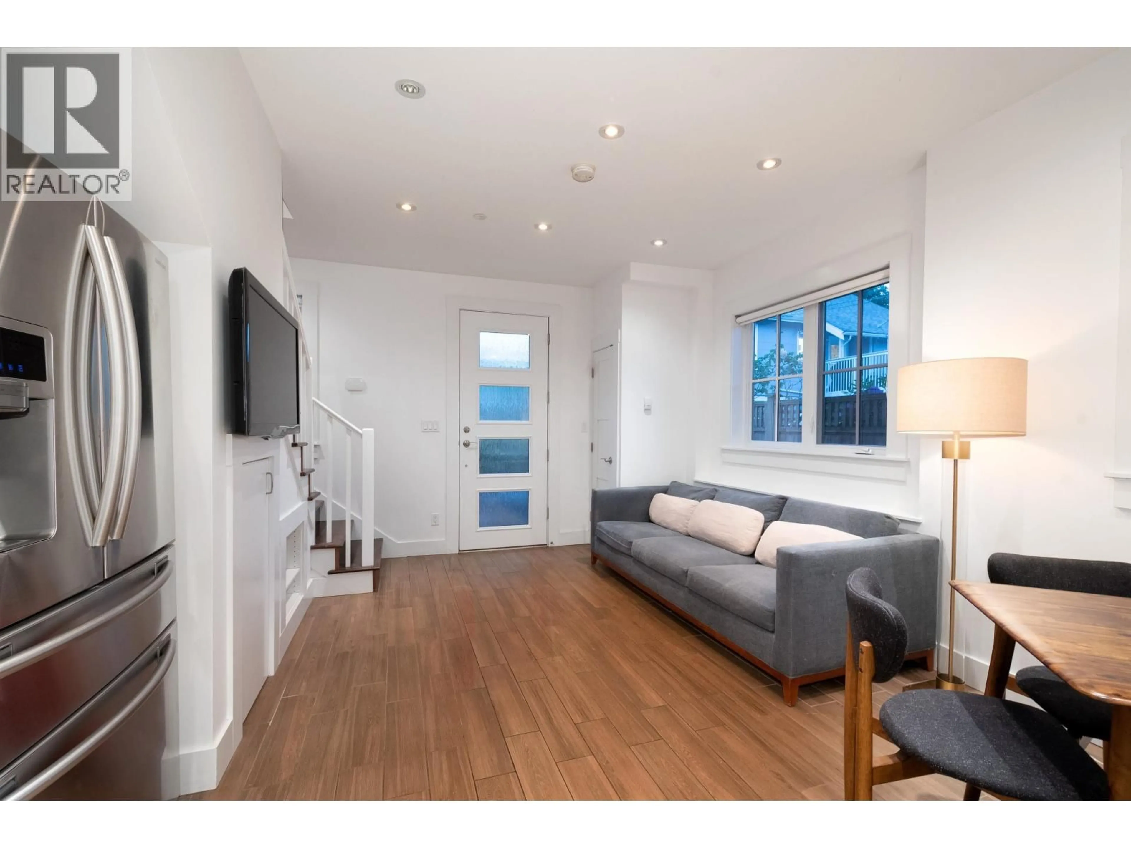 Living room with furniture, wood/laminate floor for 3132 7TH AVENUE, Vancouver British Columbia V6K2A1