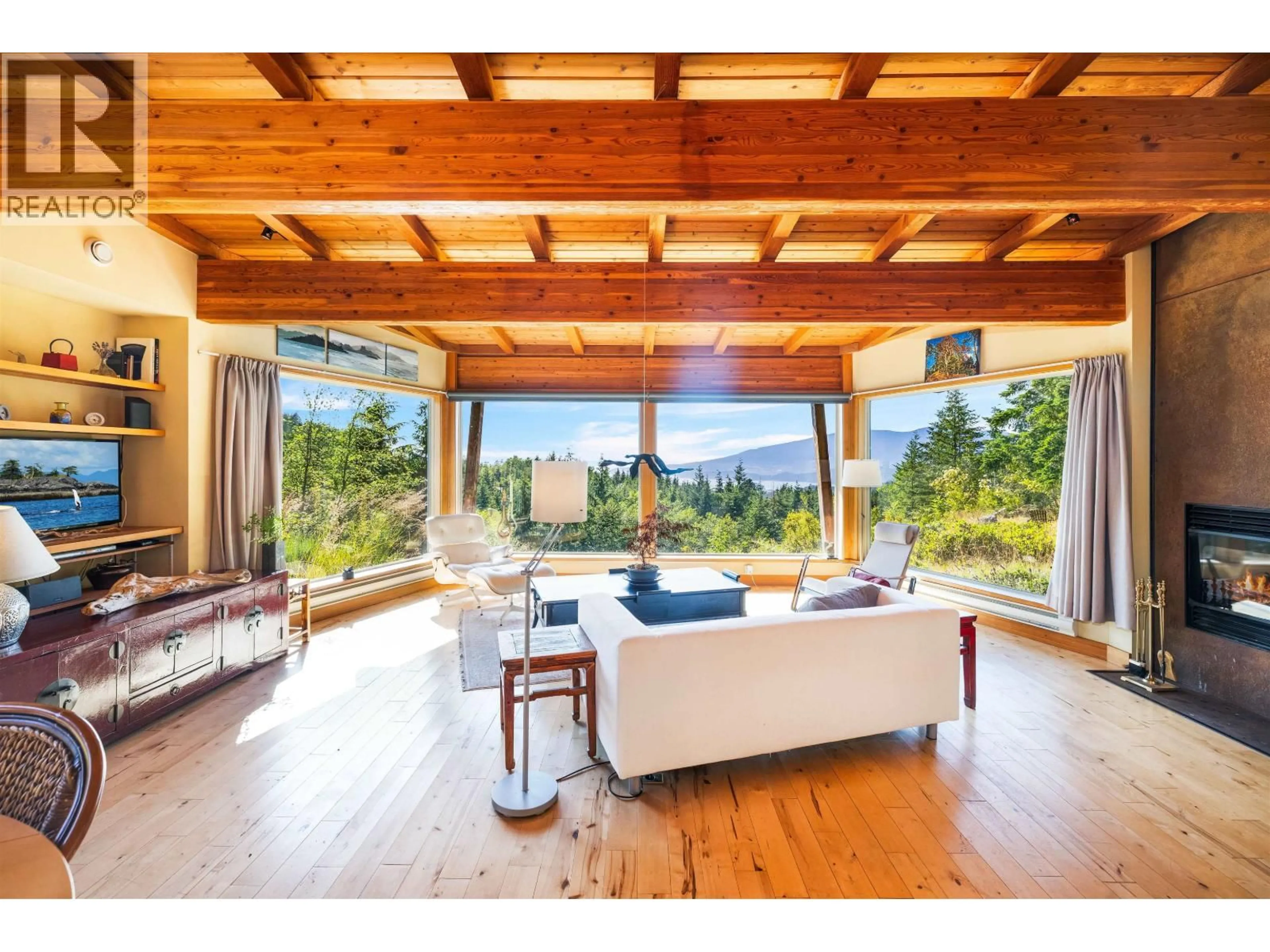 Living room with furniture, wood/laminate floor for 1301 SUNSET ROAD, Bowen Island British Columbia V0N1G2