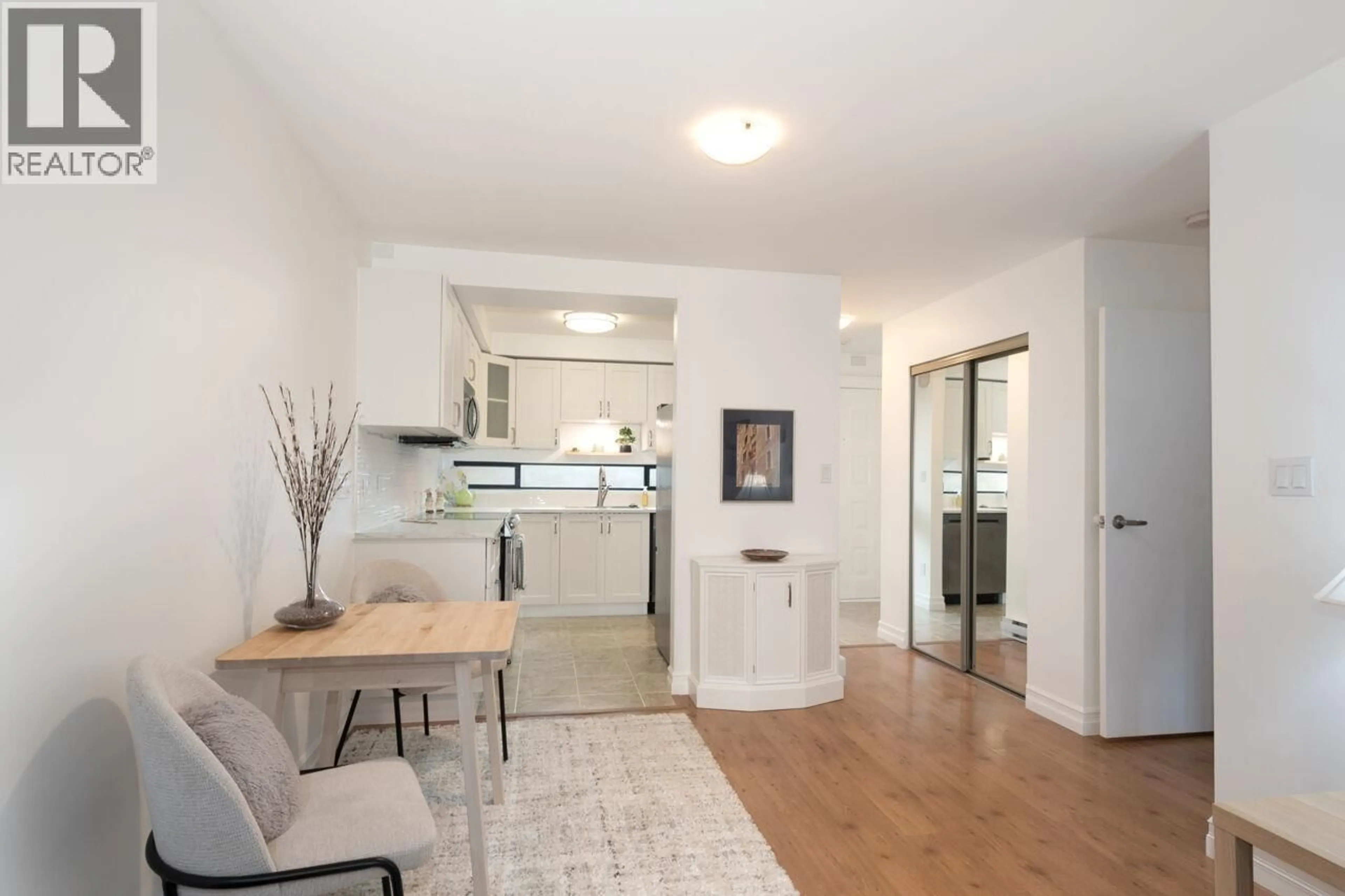 Open concept kitchen, wood/laminate floor for 214 - 140 4TH STREET, North Vancouver British Columbia V7L4R1