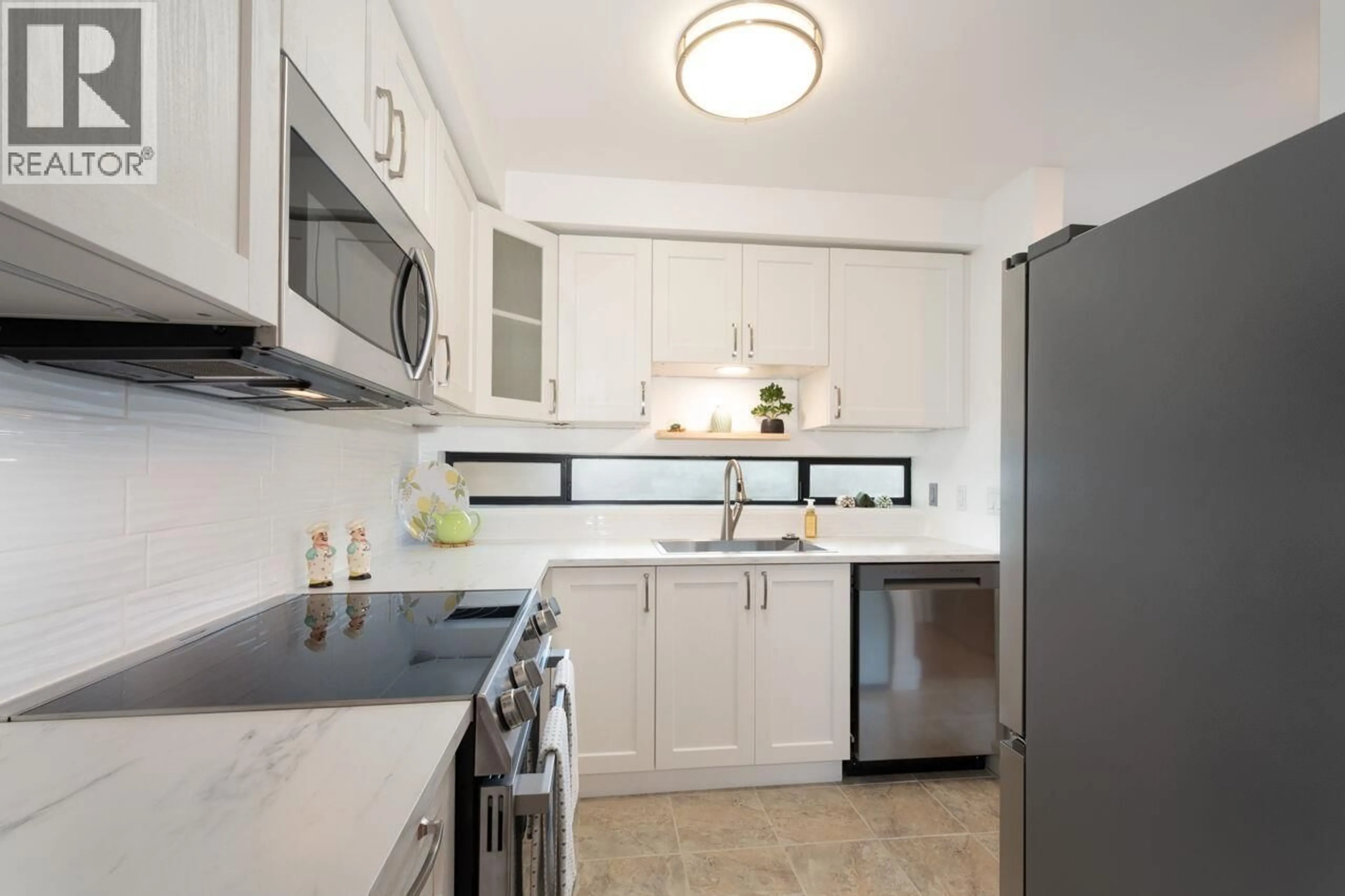 Standard kitchen, ceramic/tile floor for 214 - 140 4TH STREET, North Vancouver British Columbia V7L4R1