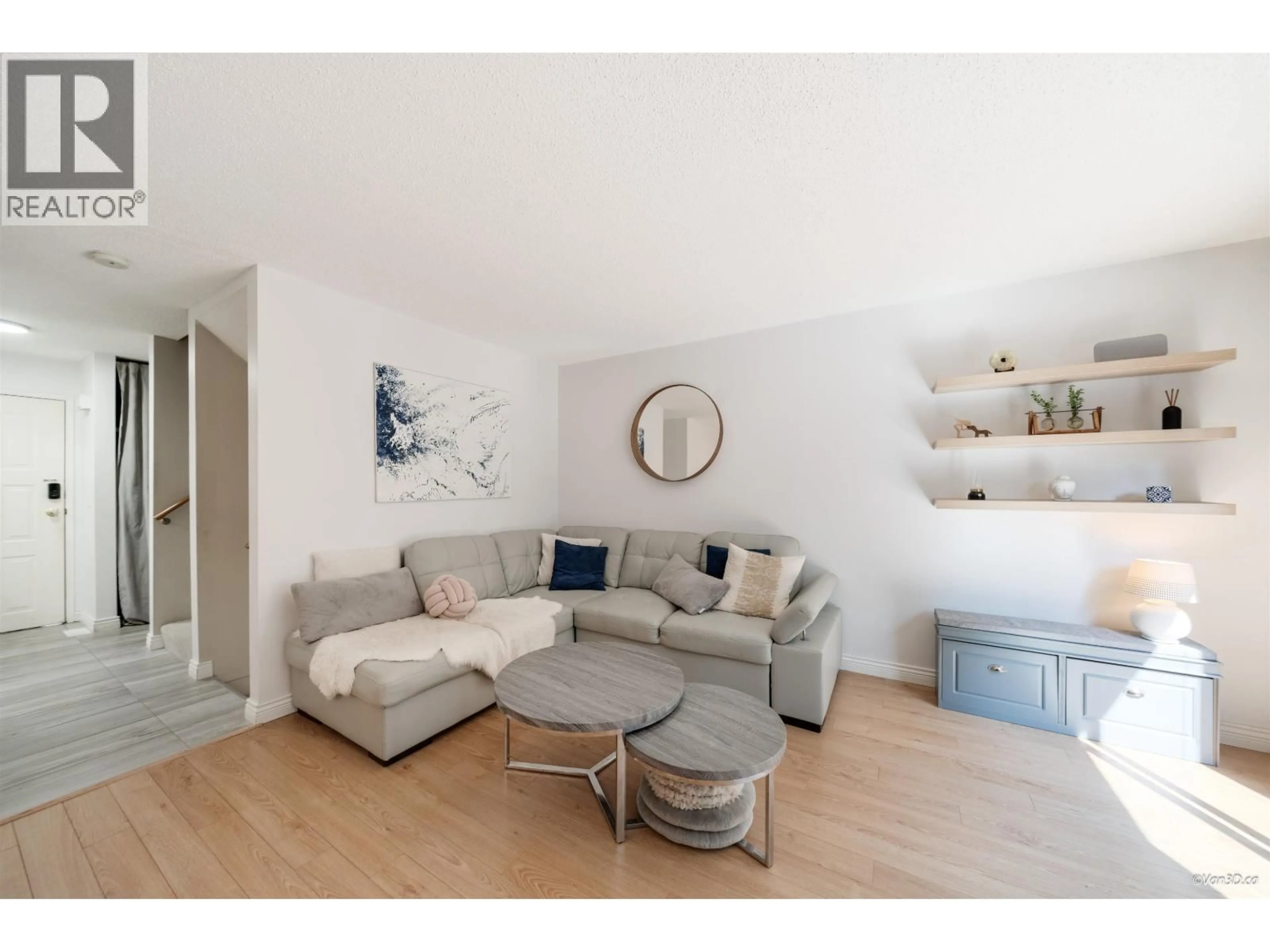 Living room with furniture, wood/laminate floor for 238 CAMBRIDGE WAY, Port Moody British Columbia V3H3W7