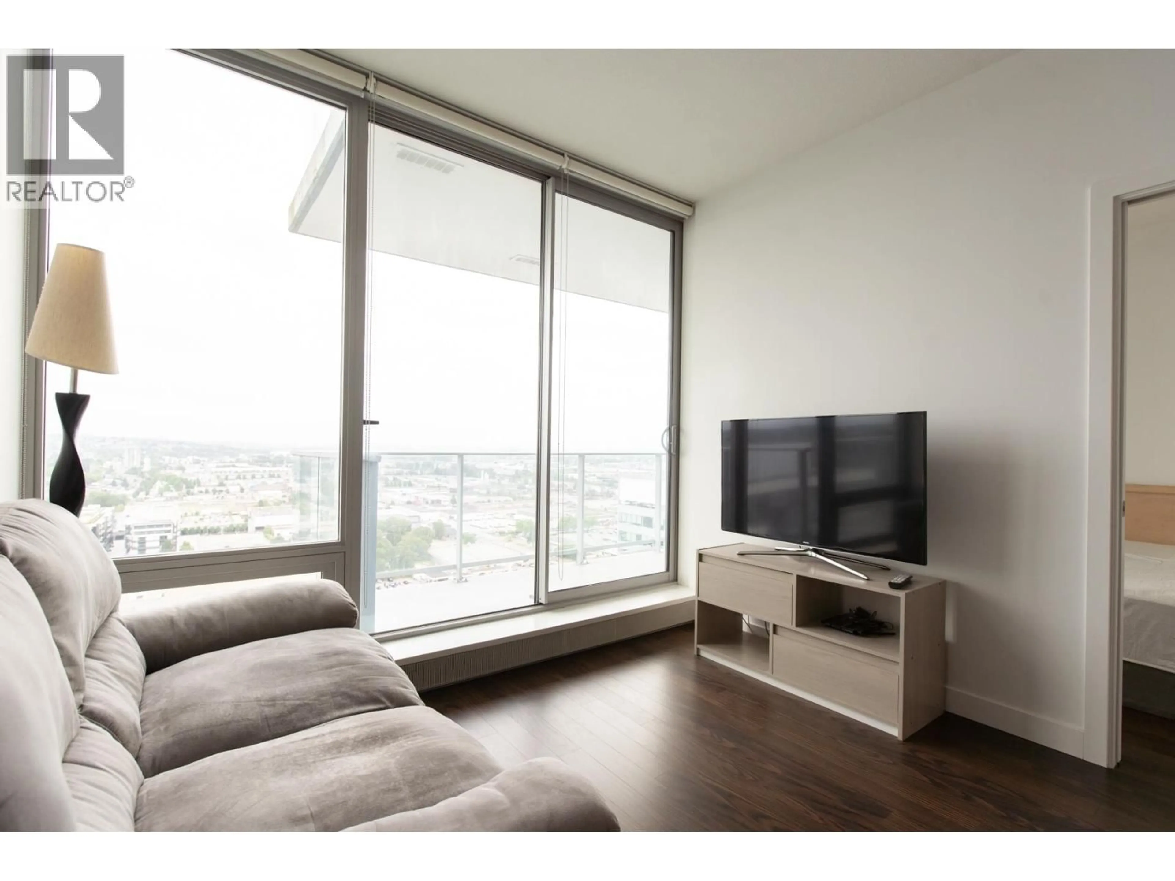 Living room with furniture, wood/laminate floor for 3006 - 8131 NUNAVUT LANE, Vancouver British Columbia V5X0E2