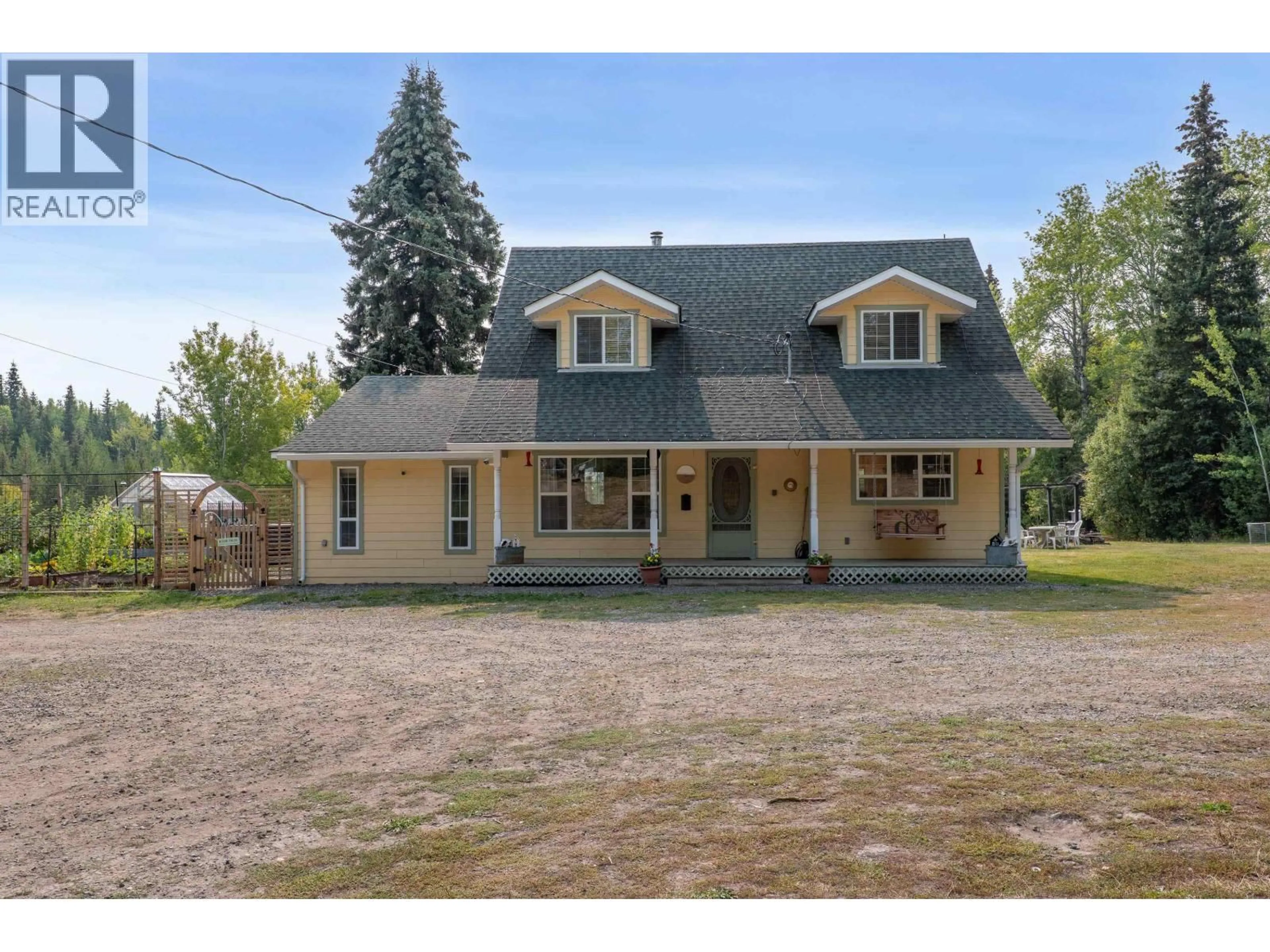 A pic from outside/outdoor area/front of a property/back of a property/a pic from drone, street for 7492 FRASER WAY, Bridge Lake British Columbia V0K1X1