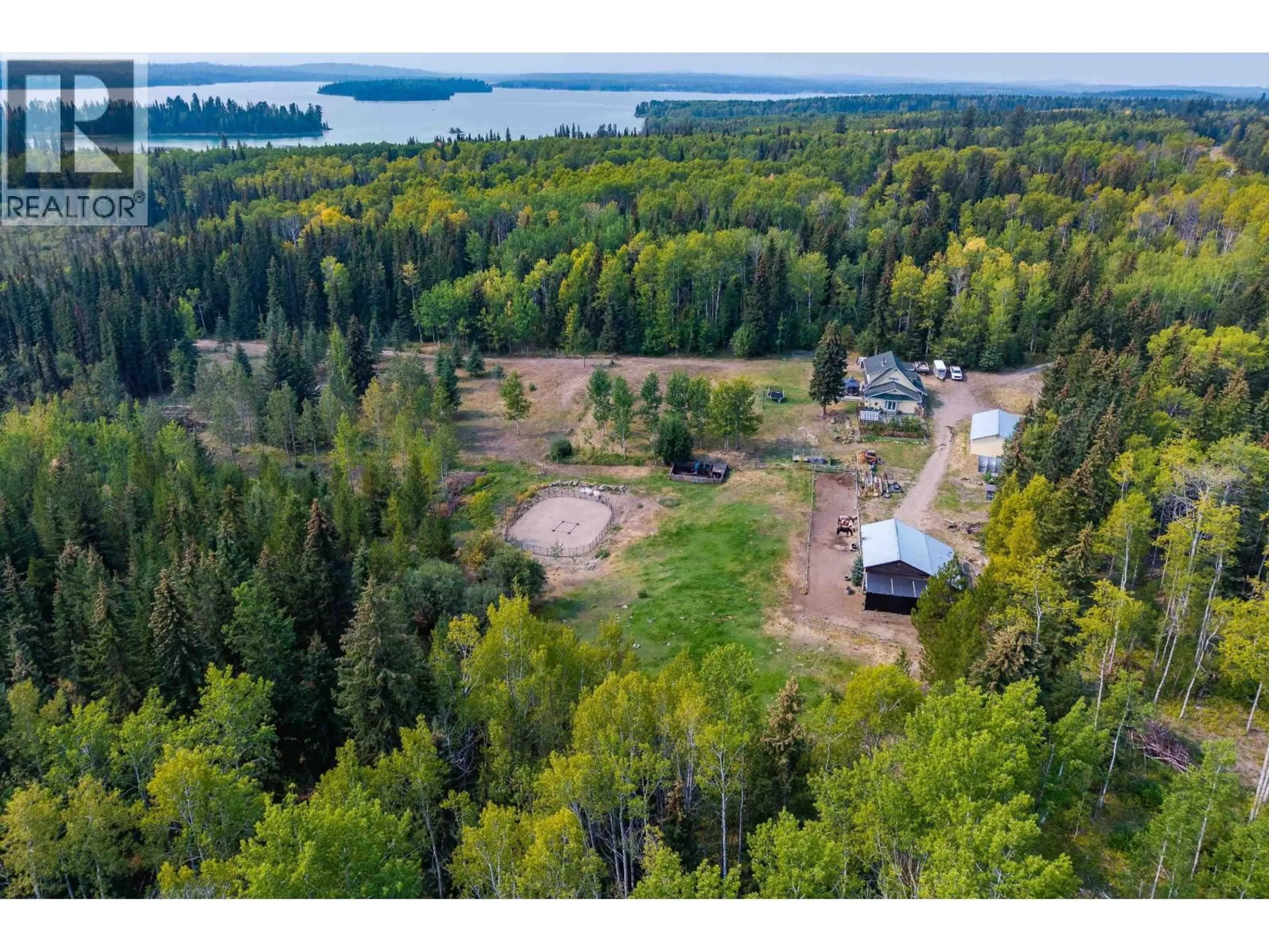 A pic from outside/outdoor area/front of a property/back of a property/a pic from drone, water/lake/river/ocean view for 7492 FRASER WAY, Bridge Lake British Columbia V0K1X1