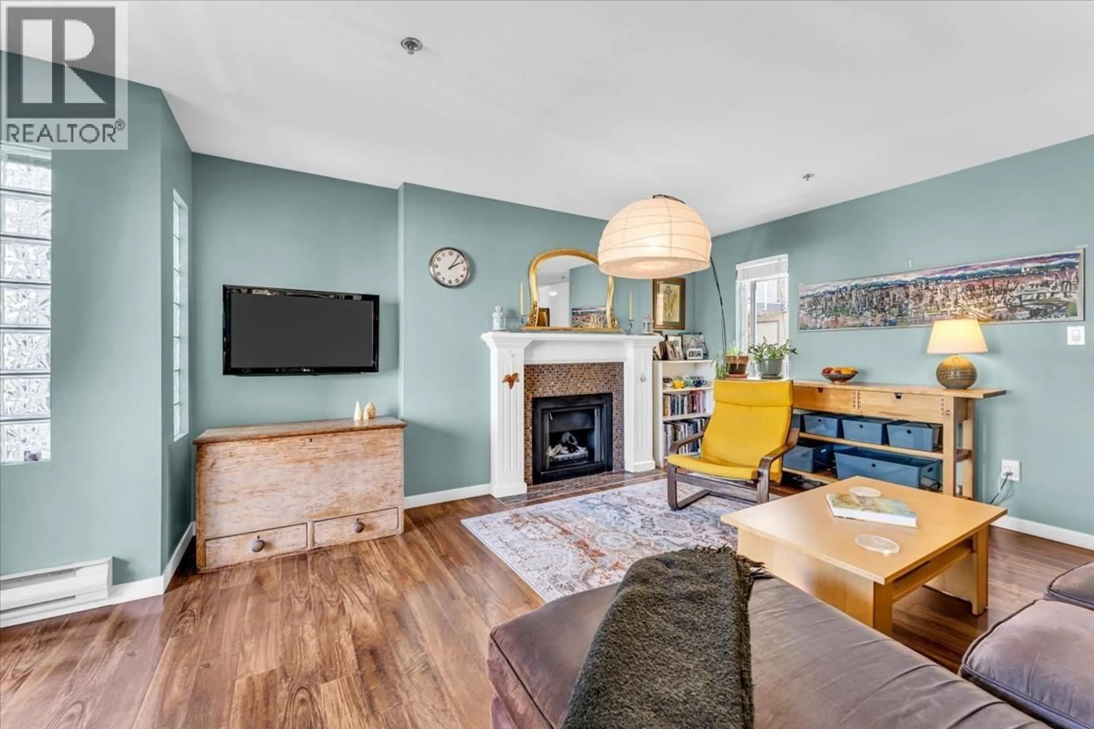 Living room with furniture, wood/laminate floor for 303 - 966 14 AVENUE, Vancouver British Columbia V5Z1R4