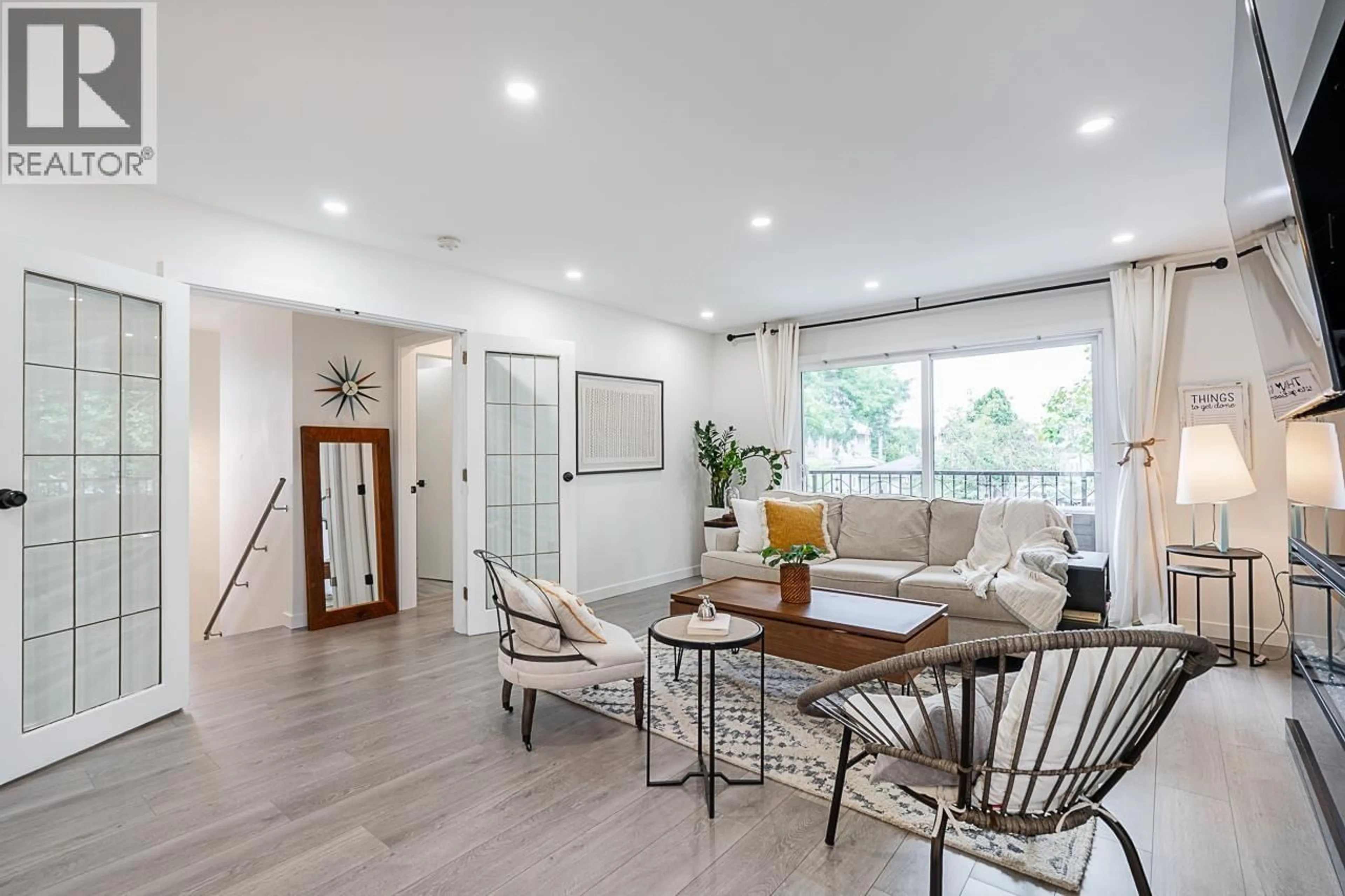 Living room with furniture, wood/laminate floor for 1712 34 AVENUE, Vancouver British Columbia V5P1A3