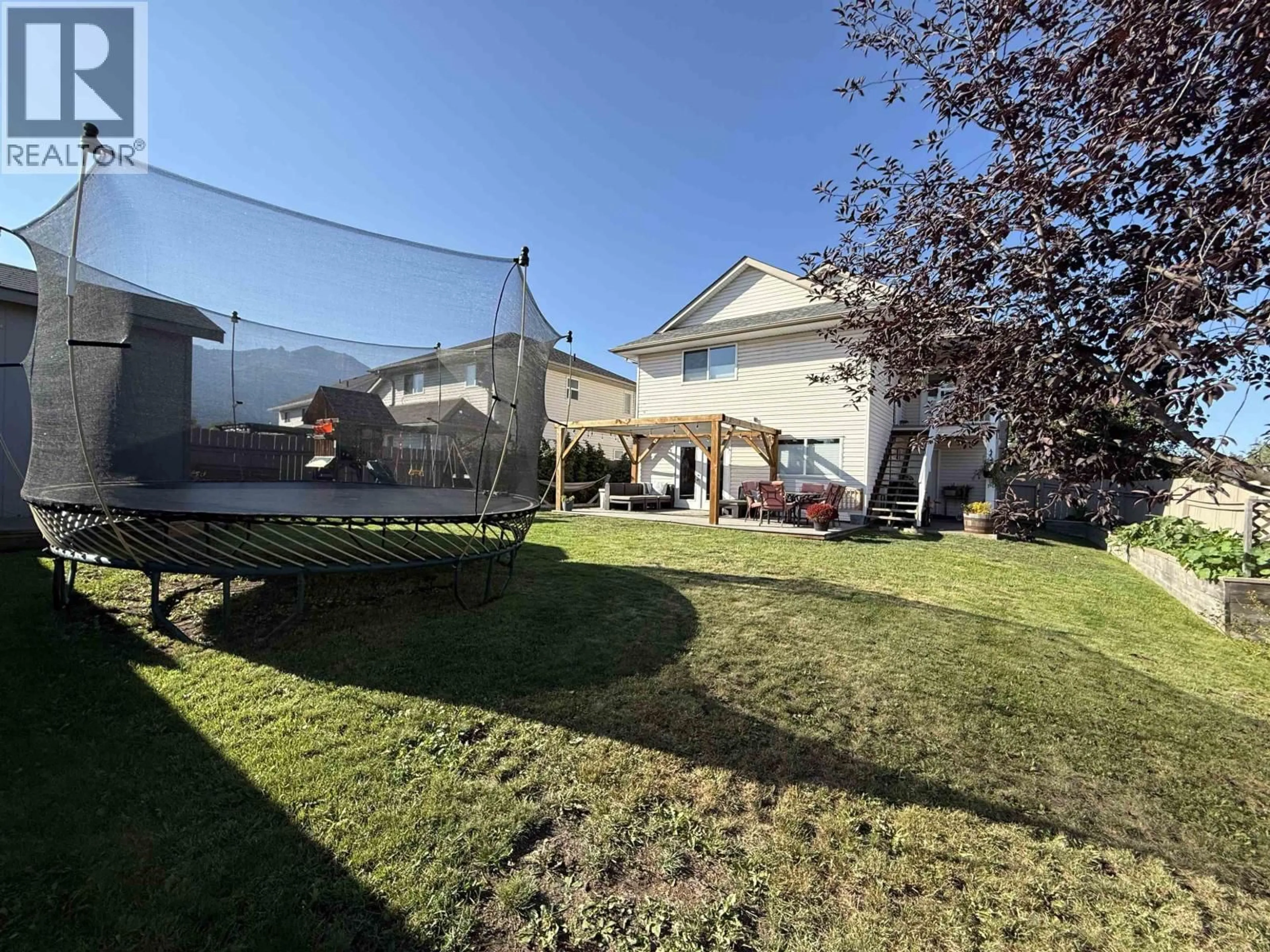 A pic from outside/outdoor area/front of a property/back of a property/a pic from drone, street for 1471 DRIFTWOOD CRESCENT, Smithers British Columbia V0J2N0