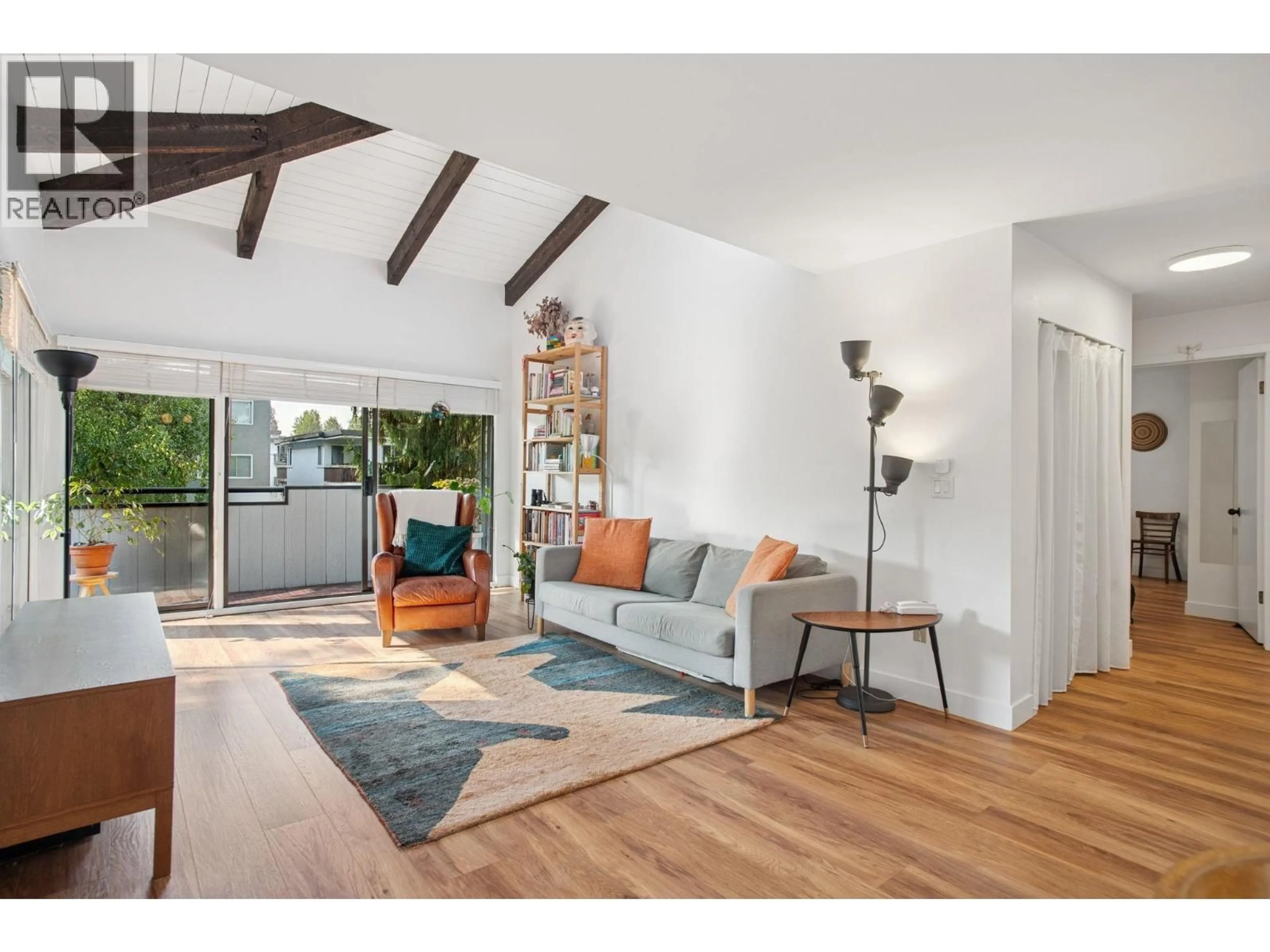 Living room with furniture, wood/laminate floor for 303 - 2277 MCGILL STREET, Vancouver British Columbia V5L1C3