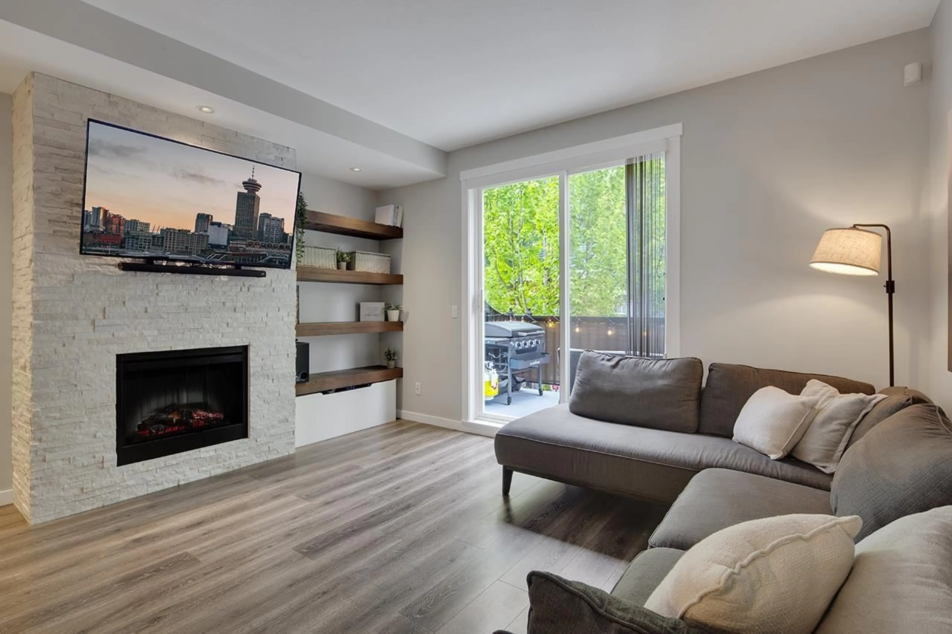 Living room with furniture, wood/laminate floor for 33 - 18983 72A, Surrey British Columbia V4N1A5