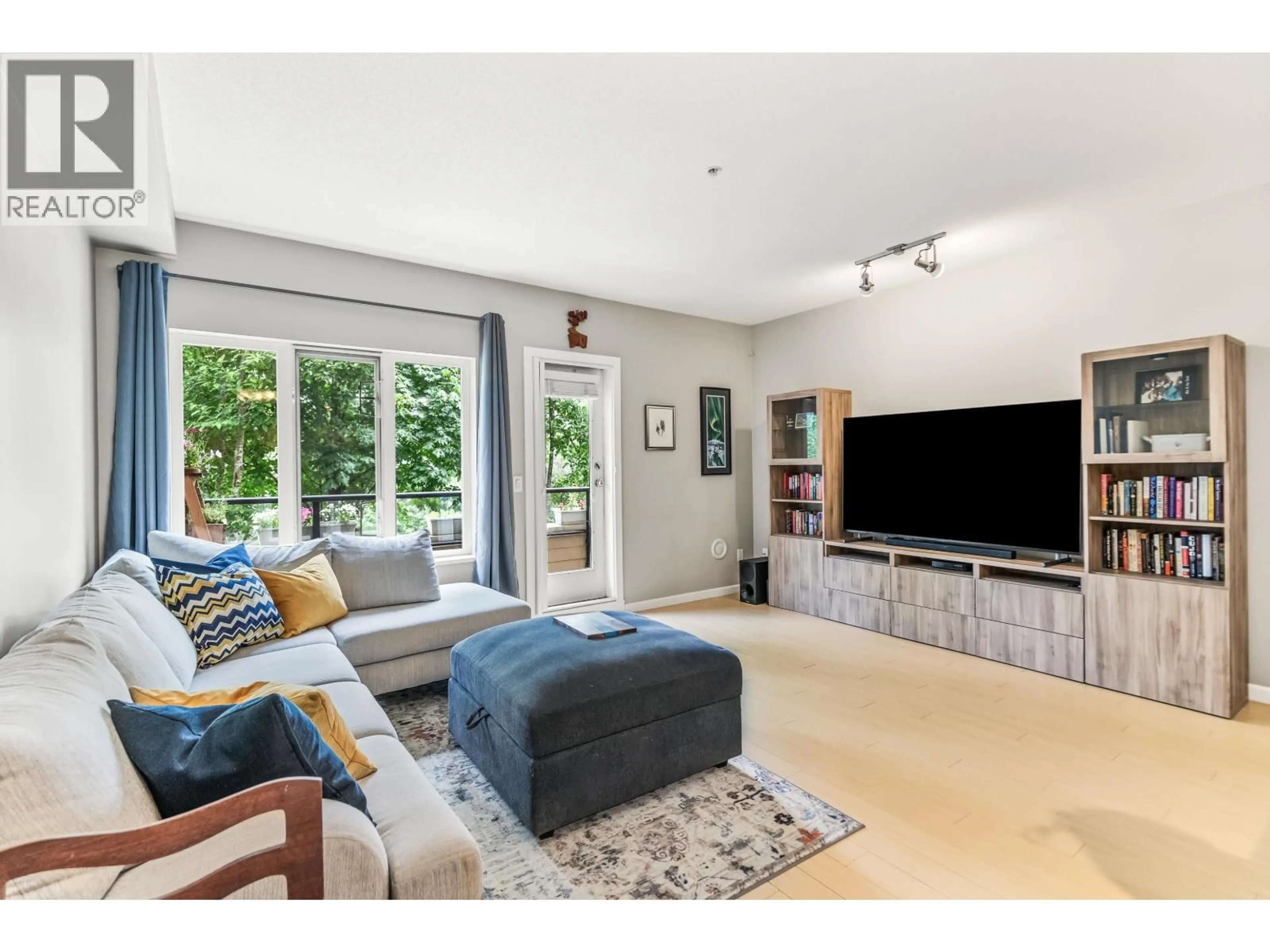 Living room with furniture, unknown for 109 - 160 SHORELINE CIRCLE, Port Moody British Columbia V3H0B2