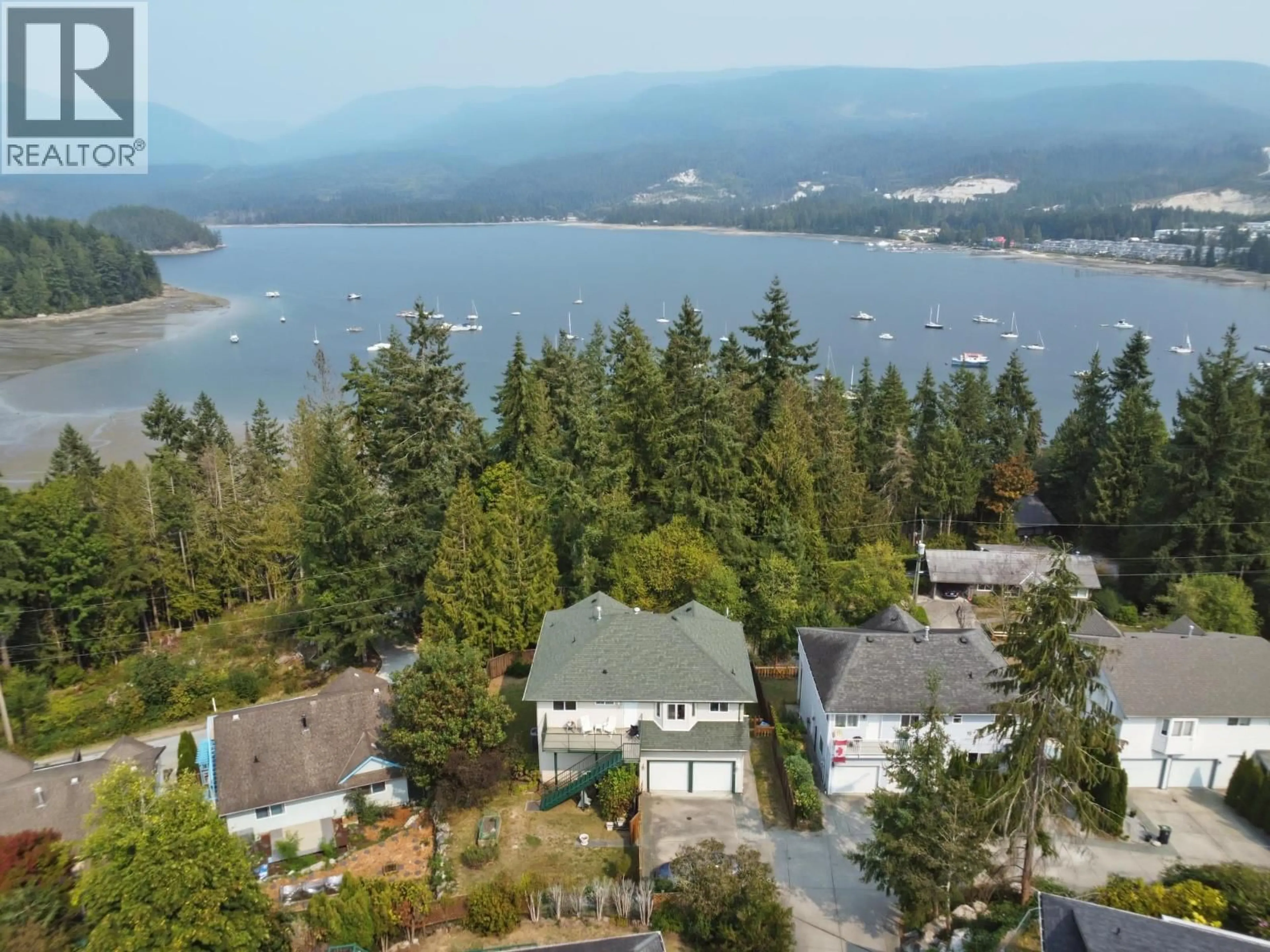 A pic from outside/outdoor area/front of a property/back of a property/a pic from drone, water/lake/river/ocean view for 5866A TURNSTONE CRESCENT, Sechelt British Columbia V7Z0L9