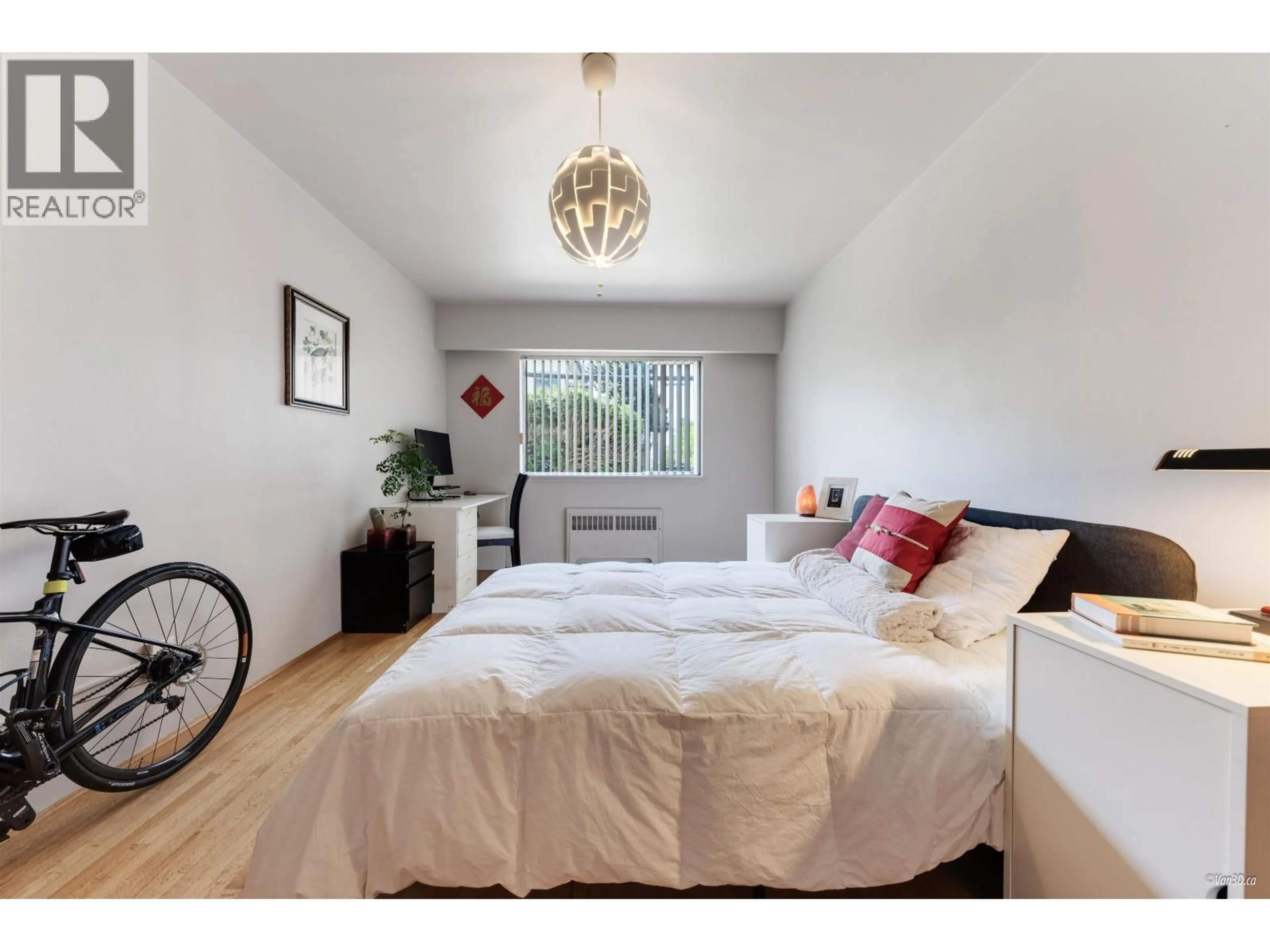 Bedroom with bed, wood/laminate floor for 105 - 2250 43RD AVENUE, Vancouver British Columbia V6M2E3