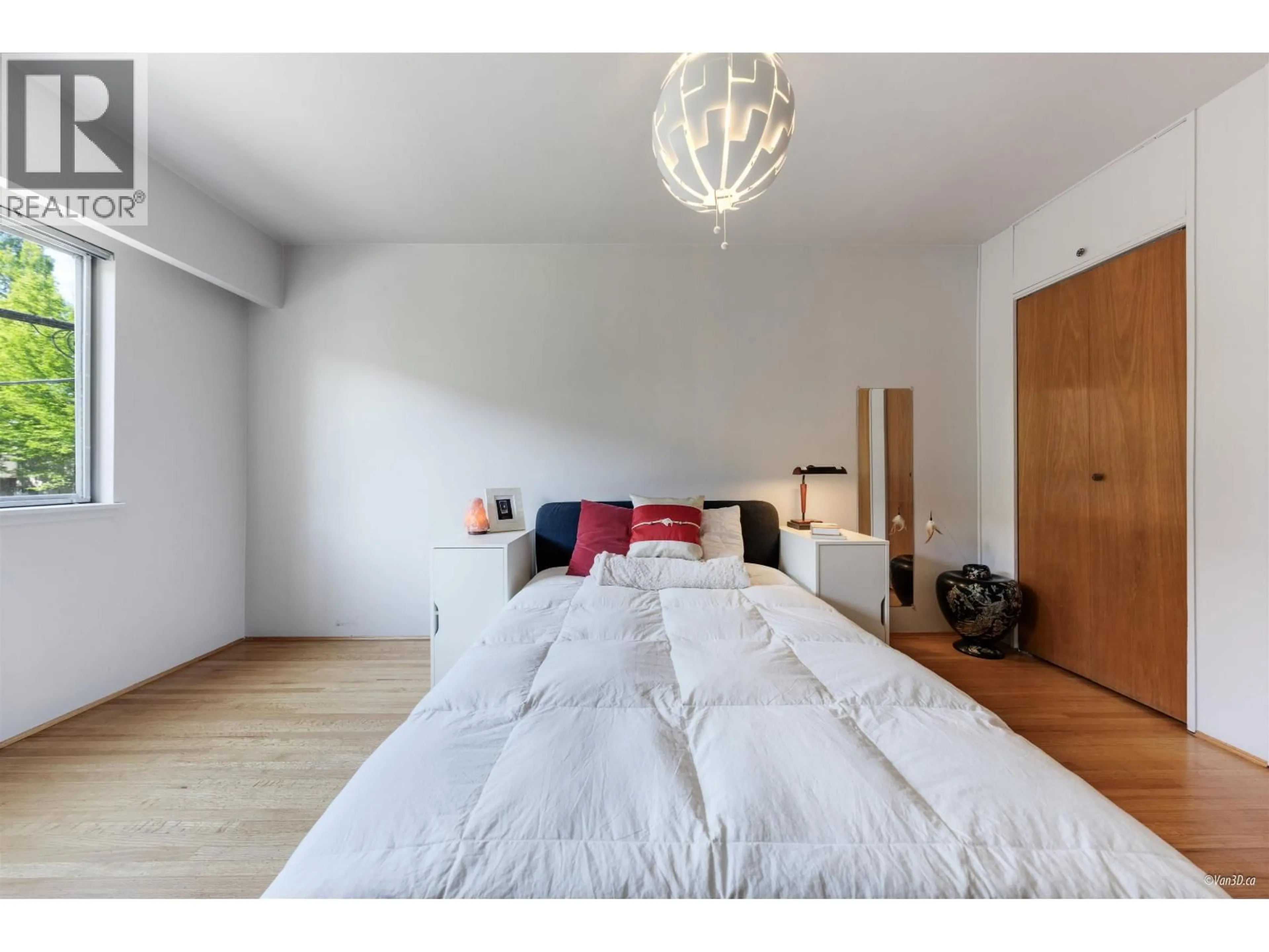Bedroom with bed, wood/laminate floor for 105 - 2250 43RD AVENUE, Vancouver British Columbia V6M2E3