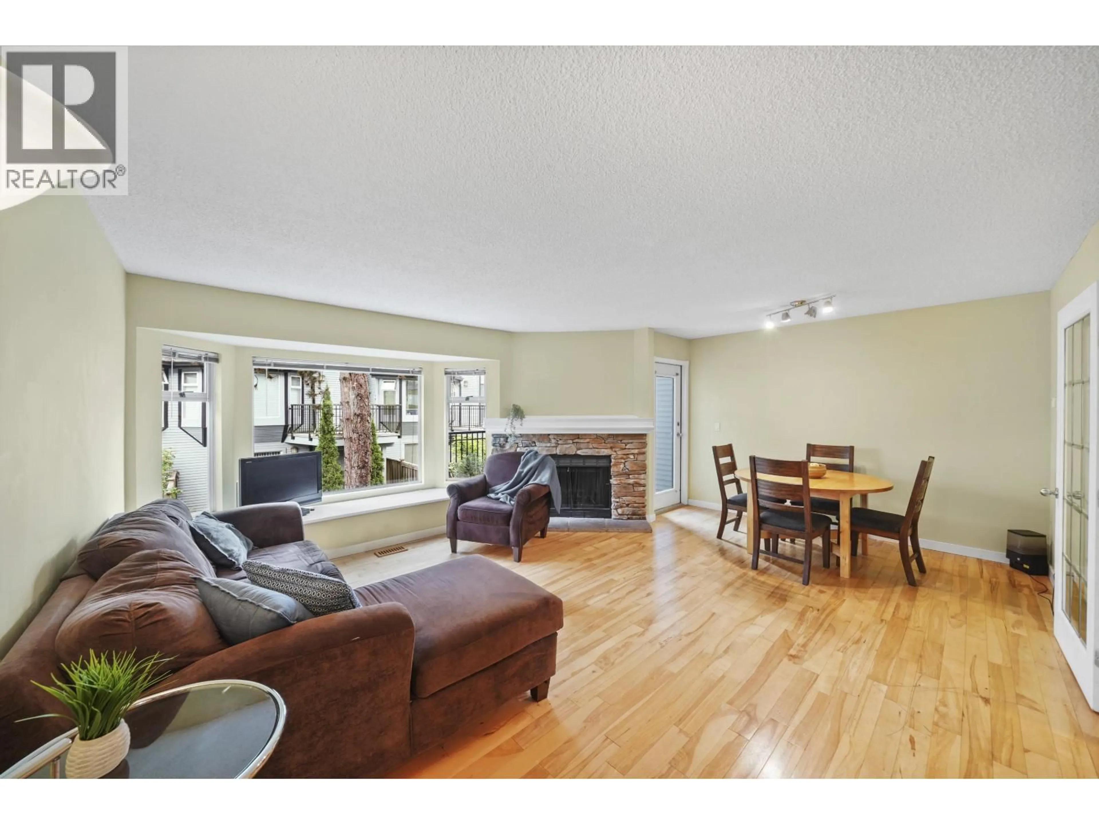 Living room with furniture, wood/laminate floor for 60 - 1195 FALCON DRIVE, Coquitlam British Columbia V3E2H1