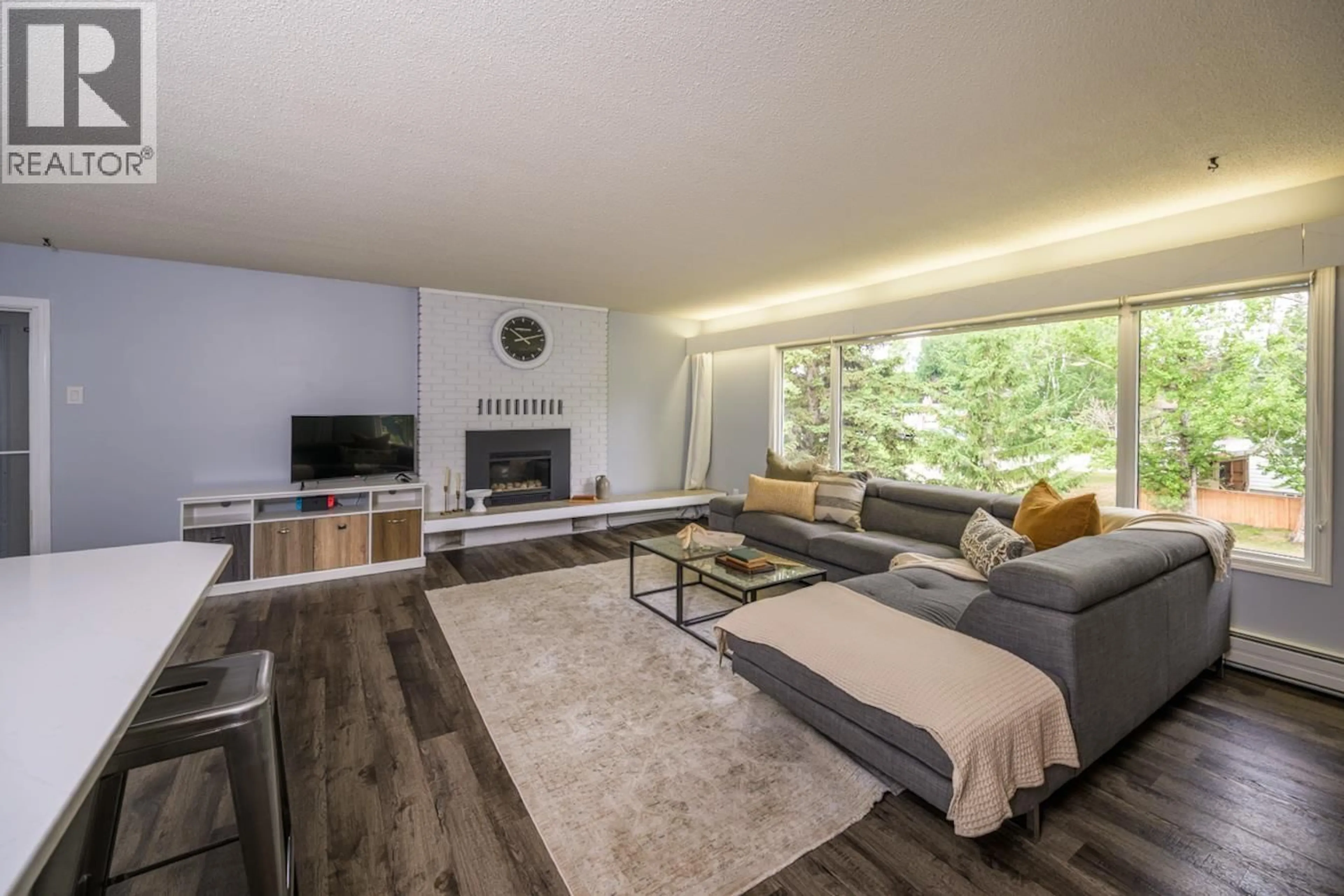 Living room with furniture, wood/laminate floor for 5300 YORK DRIVE, Prince George British Columbia V2N2A5