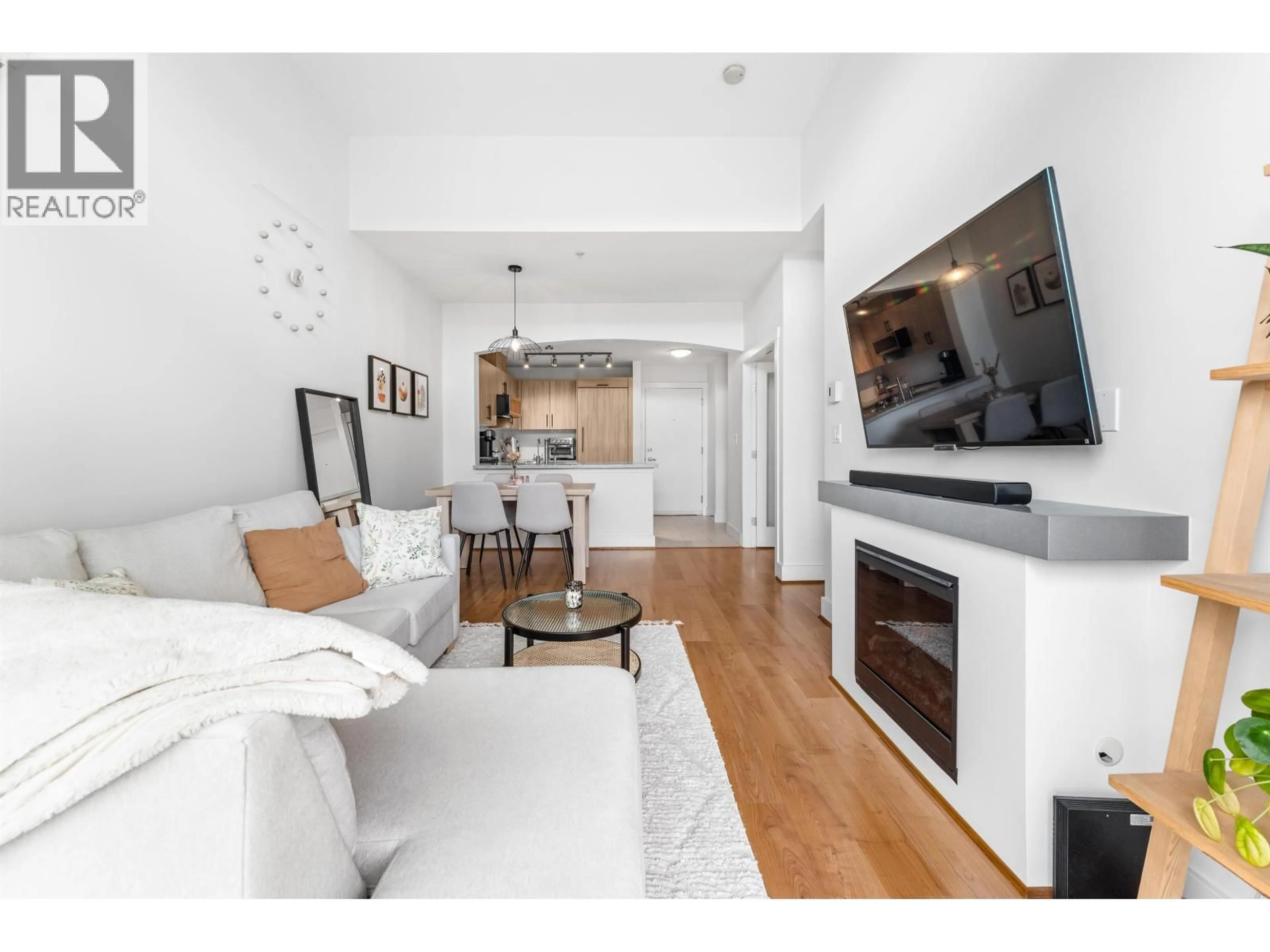 Living room with furniture, wood/laminate floor for 505 - 7428 BYRNEPARK WALK, Burnaby British Columbia V3N0B4
