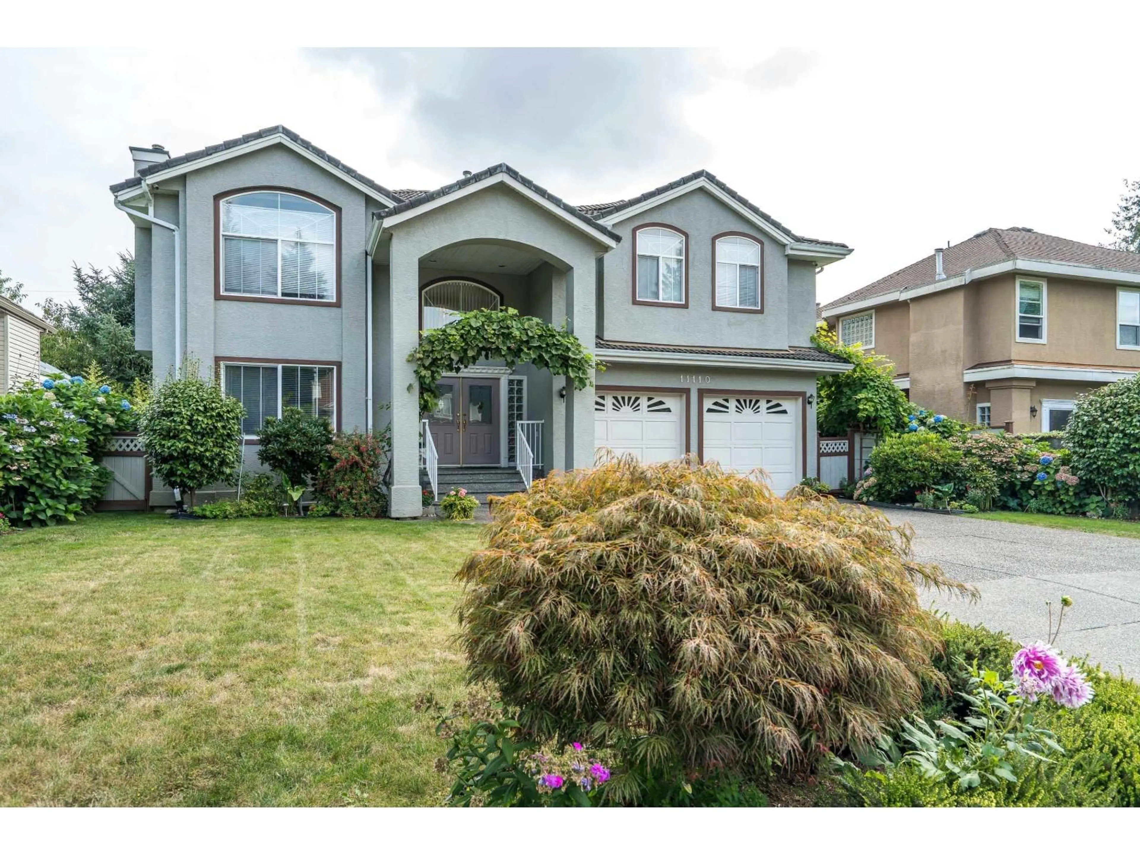 Home with vinyl exterior material, street for 11110 157A, Surrey British Columbia V4N4X1