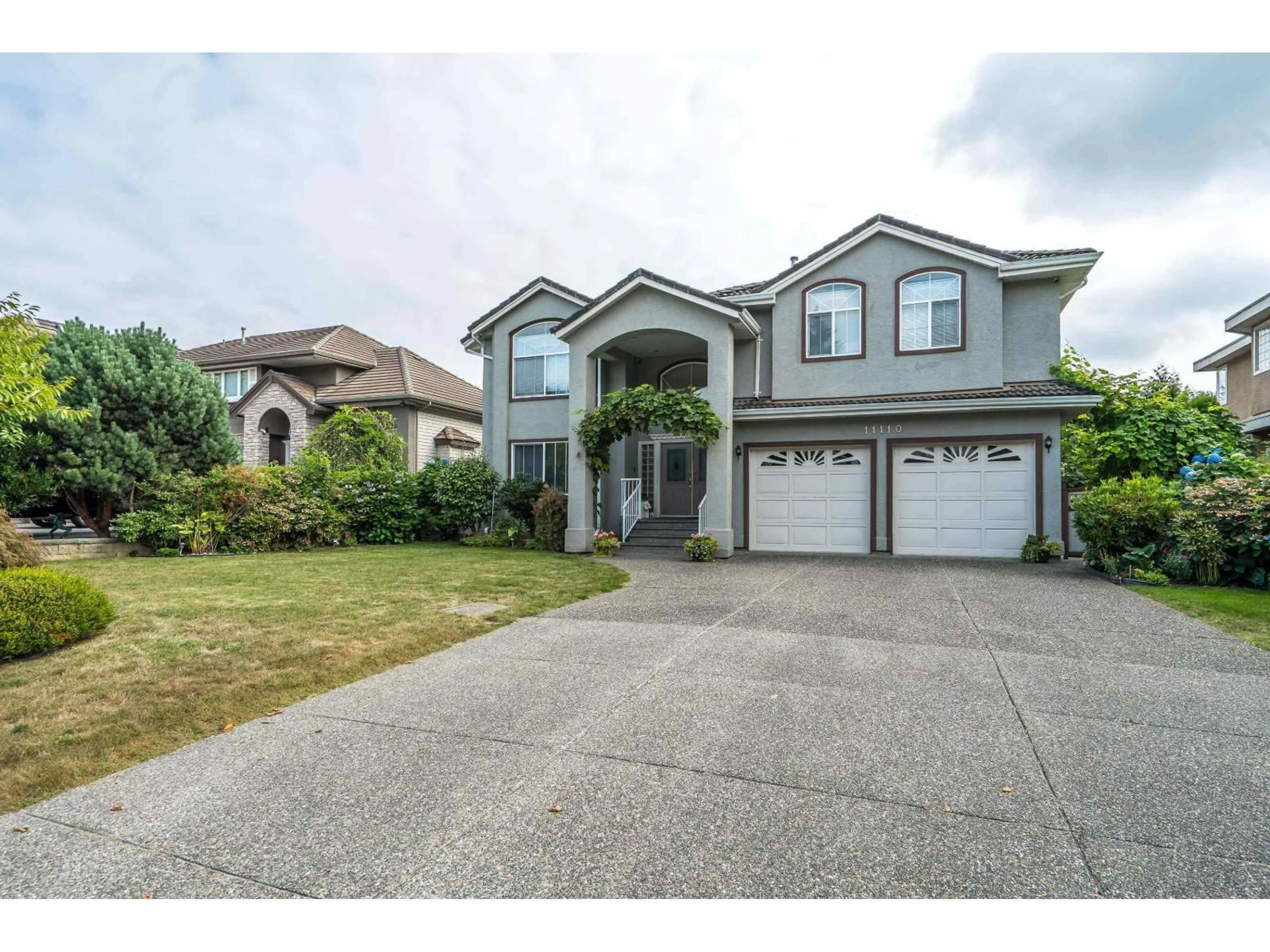 Home with vinyl exterior material, street for 11110 157A, Surrey British Columbia V4N4X1