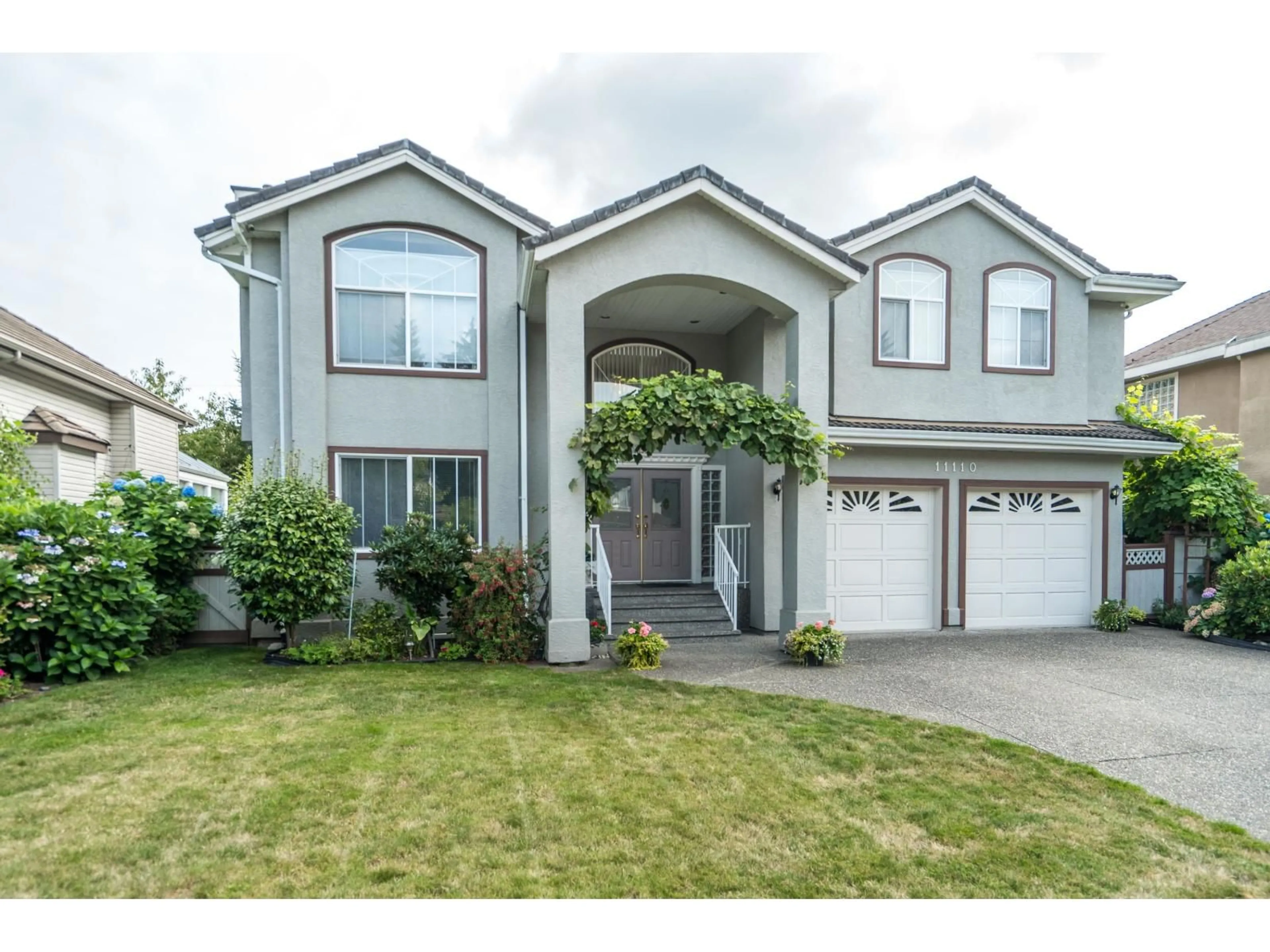 Home with vinyl exterior material, street for 11110 157A, Surrey British Columbia V4N4X1